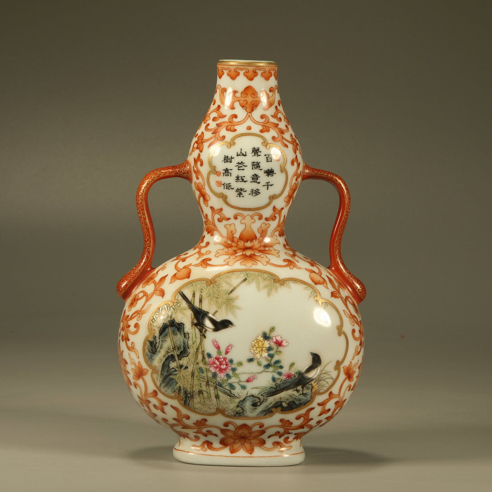 A IRON-RED GILT GOURD VASE WITH WINDOWED FLOWER, BIRD AND POEM INSCRIPTION PATTERN: Iron-red Gilt Gourd Vase with Windowed Flower, Bird and Poem Inscription Pattern