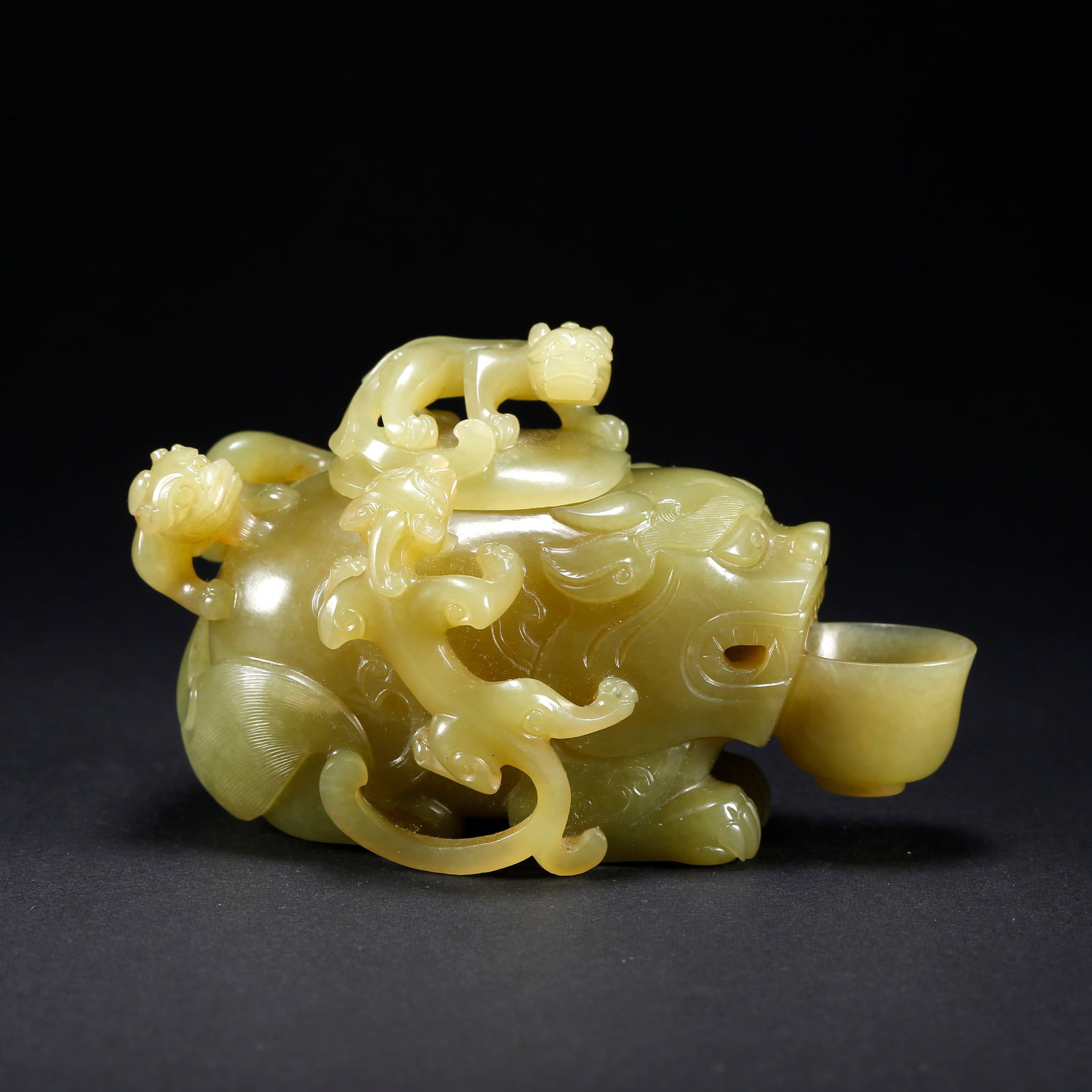 A HETIAN YELLOW JADE INK DROPPER WITH THREE-DRAGON AUSPICIOUS BEAST MOTIF: Hetian Yellow Jade Ink Dropper with Three-Dragon Auspicious Beast Motif