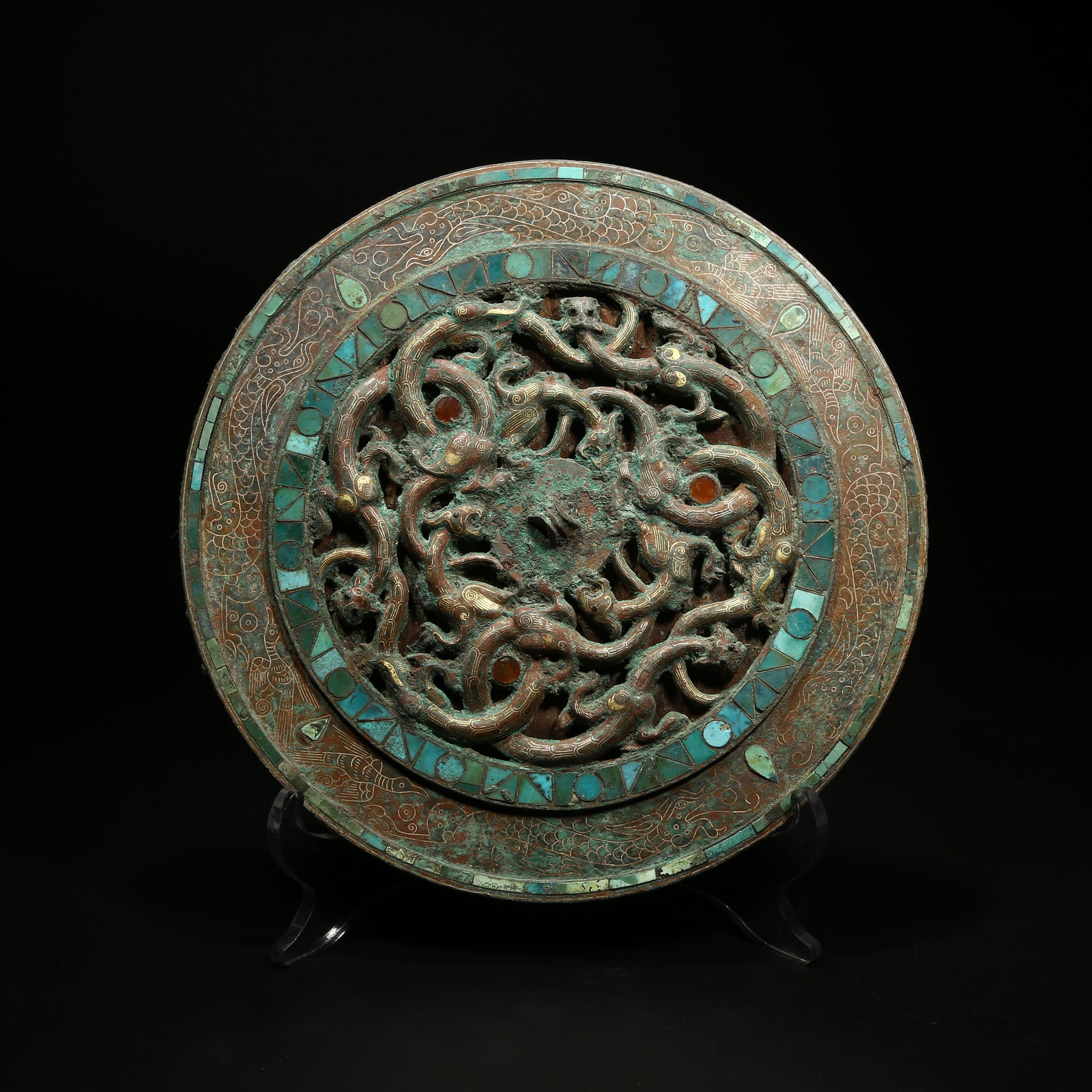 A BRONZE MIRROR WITH CHI DRAGON PATTERN INLAID WITH GOLD AND SILVER: Bronze mirror with chi dragon pattern inlaid with gold and silver