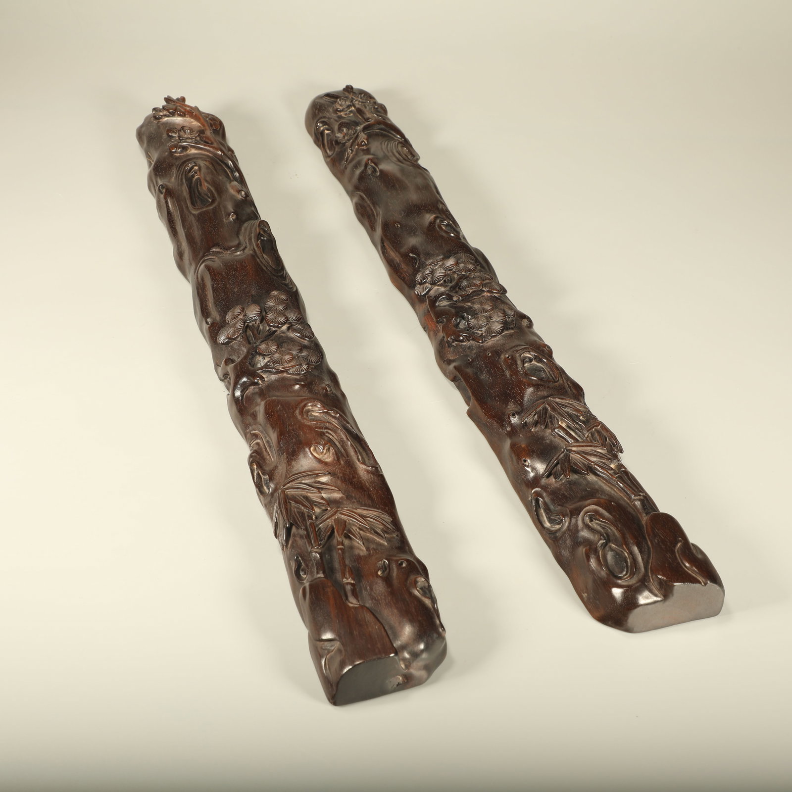 A PAIR OF ROSEWOOD PAPERWEIGHTS CARVED WITH PINE, BAMBOO AND PLUM (1 of 9)