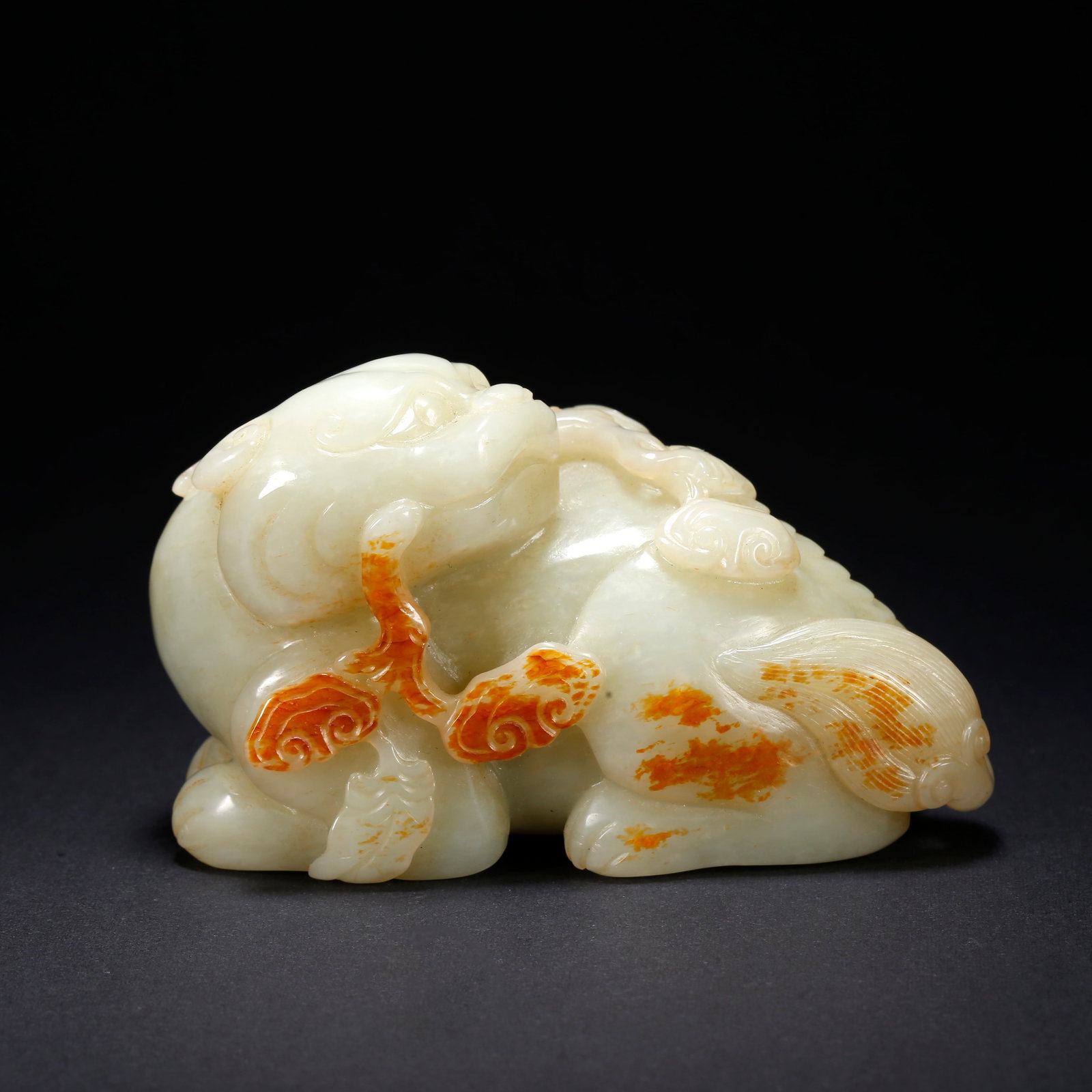 A HETIAN JADE AUSPICIOUS BEAST-SHAPED FIGURINE (1 of 10)