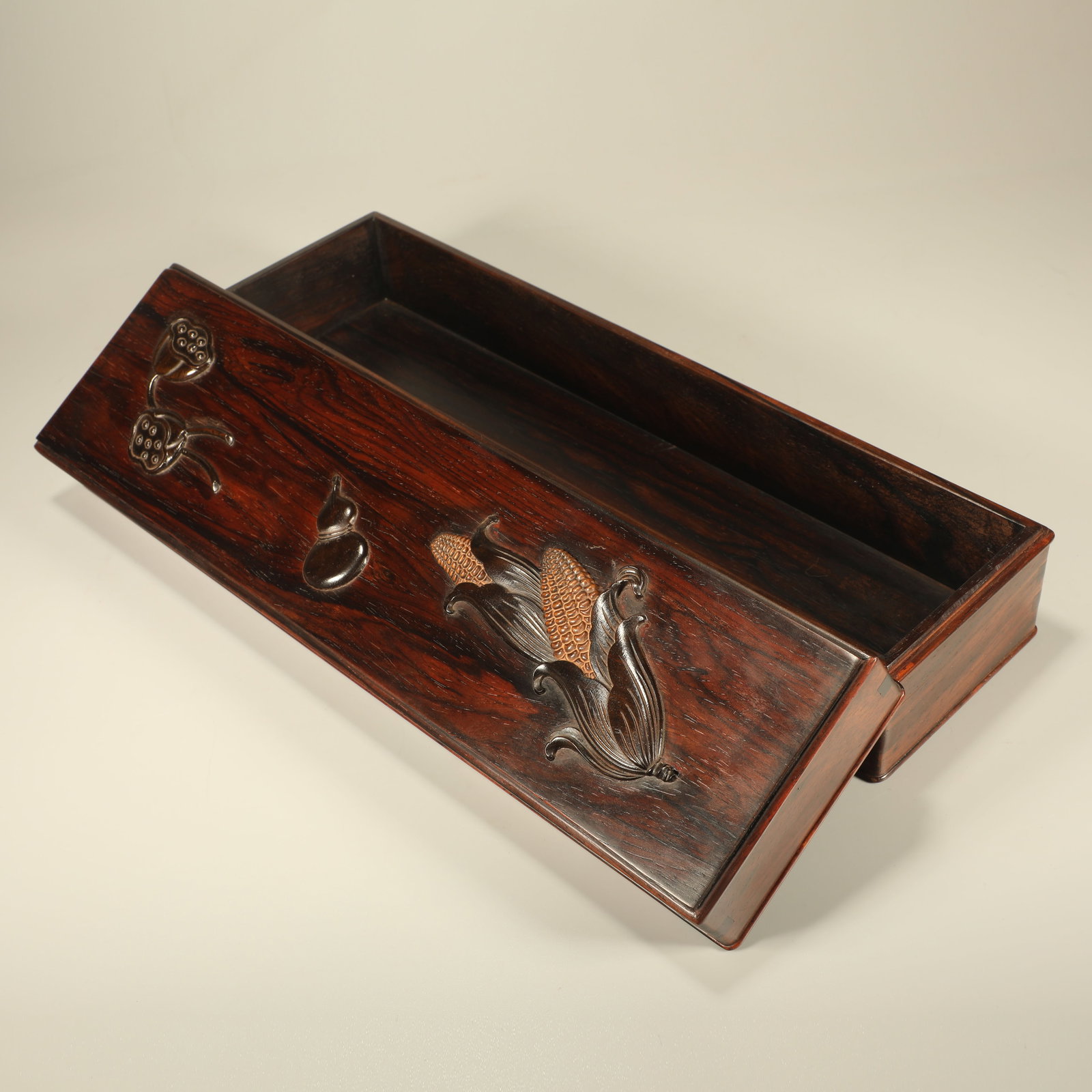 A HUANGHUALI COVERED BOX INLAID WITH RED SANDALWOOD CARVING OF MULTI-SON AND BLESSING MOTIF: Huanghuali Covered Box Inlaid with Red Sandalwood Carving of Multi-son and Blessing Motif