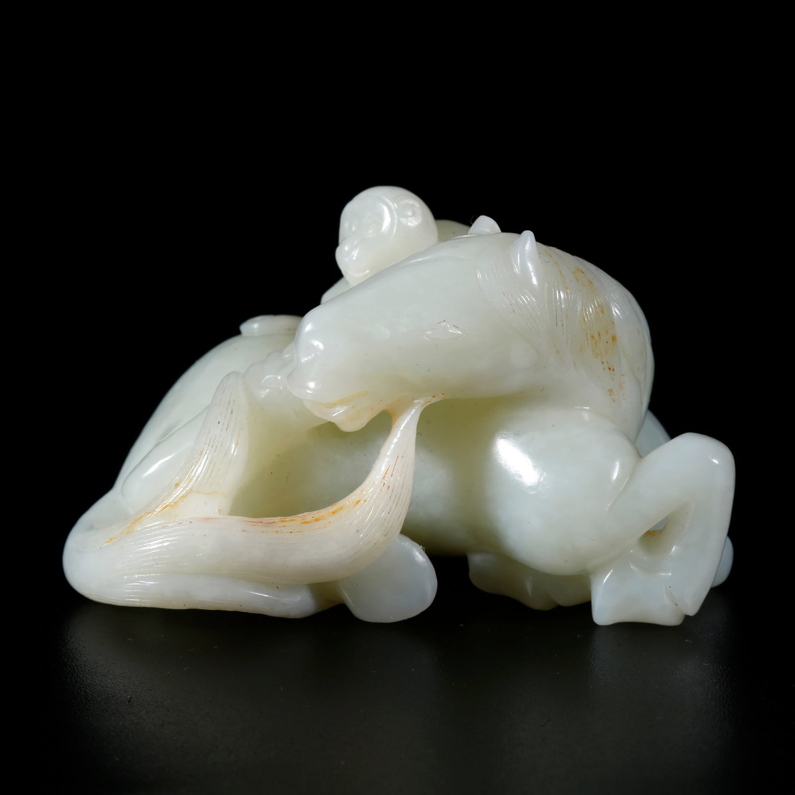 A HETIAN JADE CARVING OF HORSE-RIDING GENERAL FIGURINE (1 of 9)