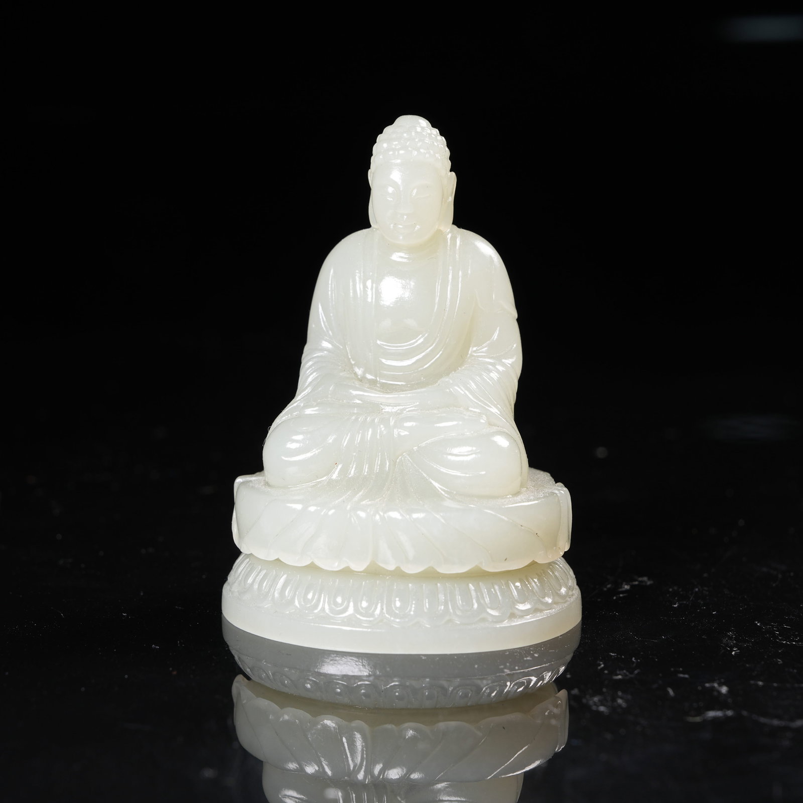 A HETIAN JADE SEATED FIGURE OF SHAKYAMUNI (1 of 8)