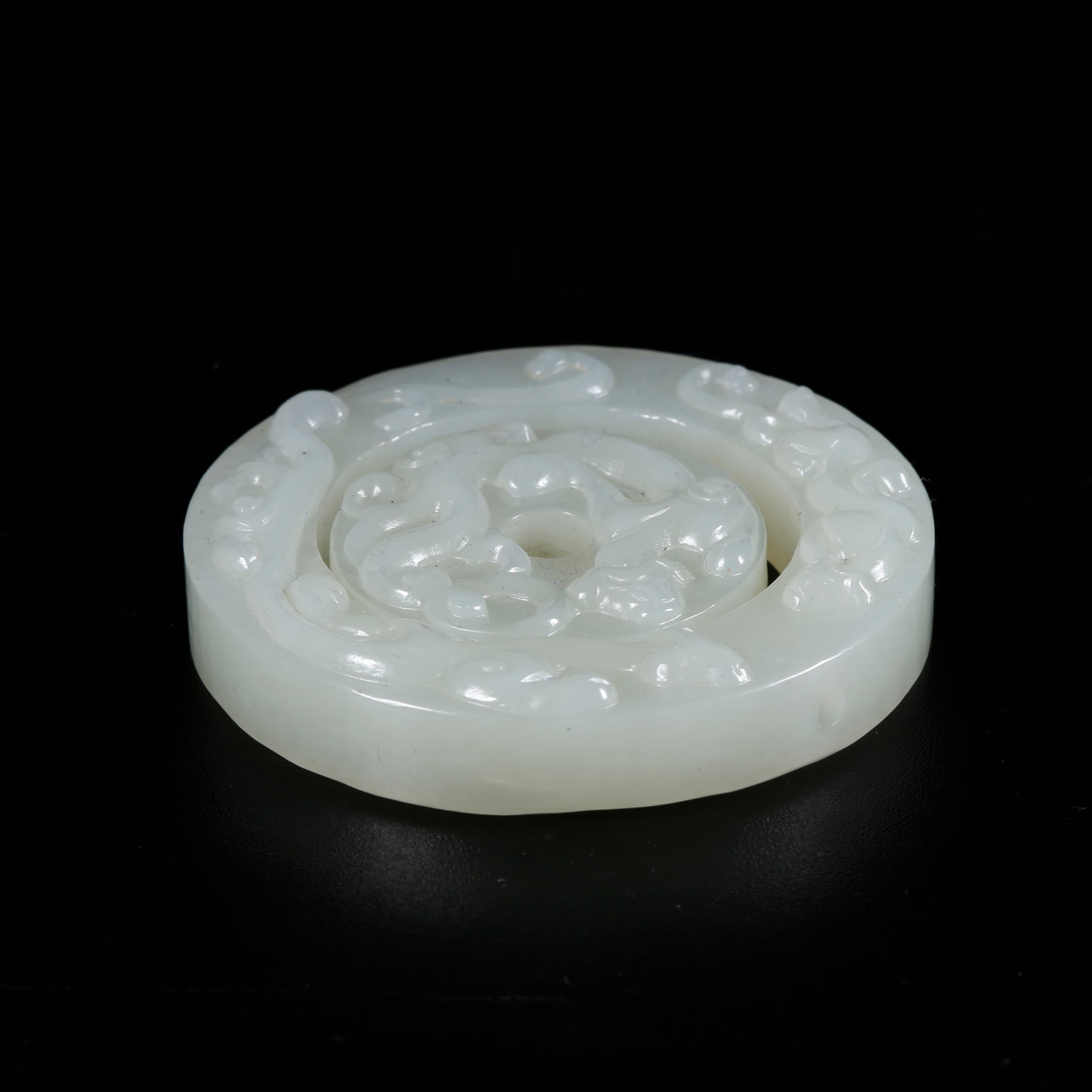 A HOTAN JADE CARVED BEAST PATTERN PENDANTS (SET) (1 of 9)