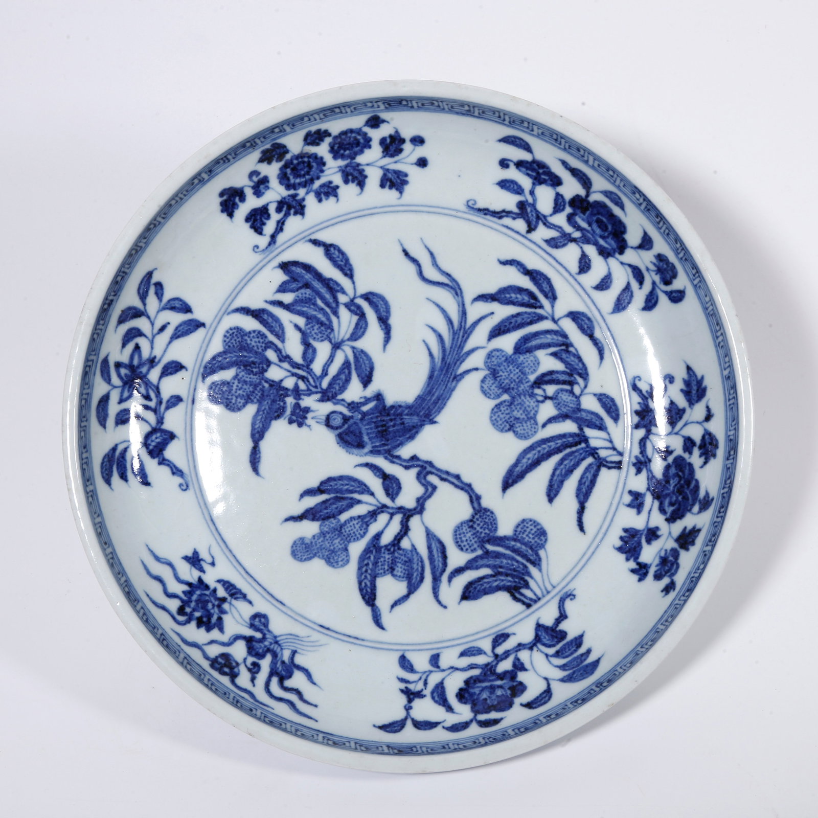 A BLUE AND WHITE PLATE WITH FLOWER AND BIRD PATTERN (1 of 9)