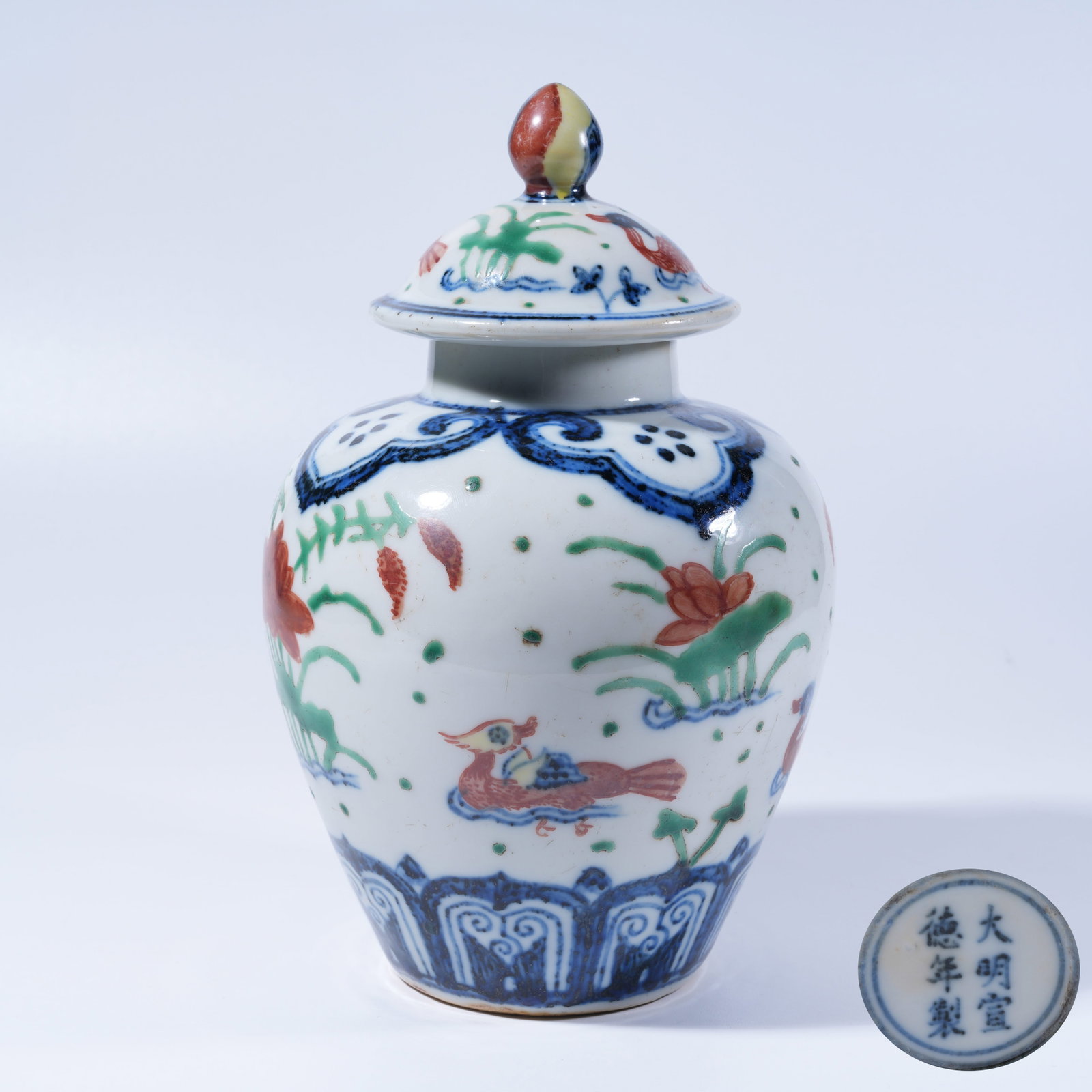 A BLUE AND WHITE UNDERGLAZE RED COVERED JAR WITH LOTUS POND LEISURE PATTERN (1 of 9)
