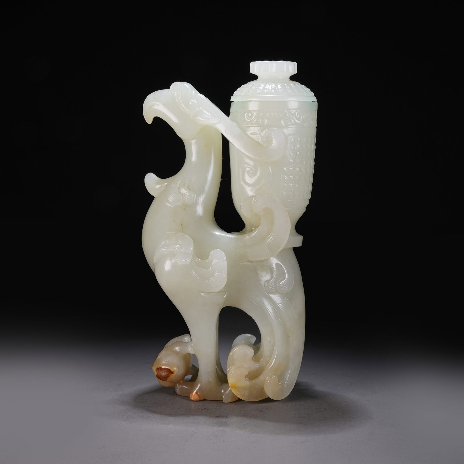 A HETIAN WHITE JADE "PHOENIX BEARING A VASE" ORNAMENT (1 of 10)