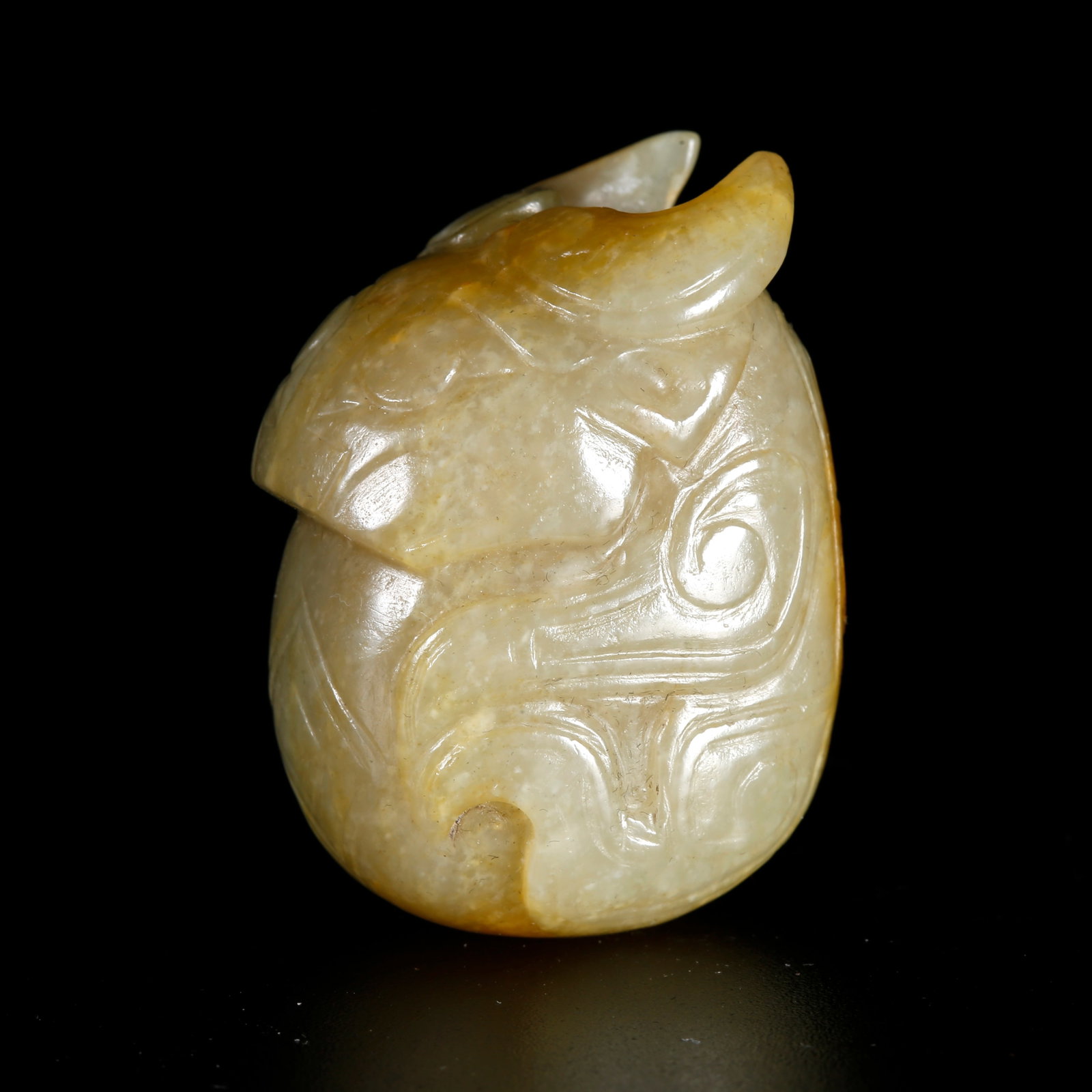 A HETIAN JADE CARVED OX-SHAPED PENDANT (1 of 10)