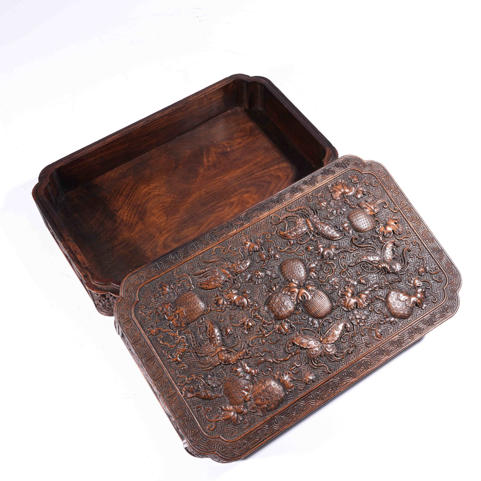 A SQUARE CHAMFERED COVERED BOX IN HUANGHUALI WOOD WITH FLOWER, BUTTERFLY, AND AUSPICIOUS FRUIT: Square Chamfered Covered Box in Huanghuali Wood with Flower, Butterfly, and Auspicious Fruit Motifs