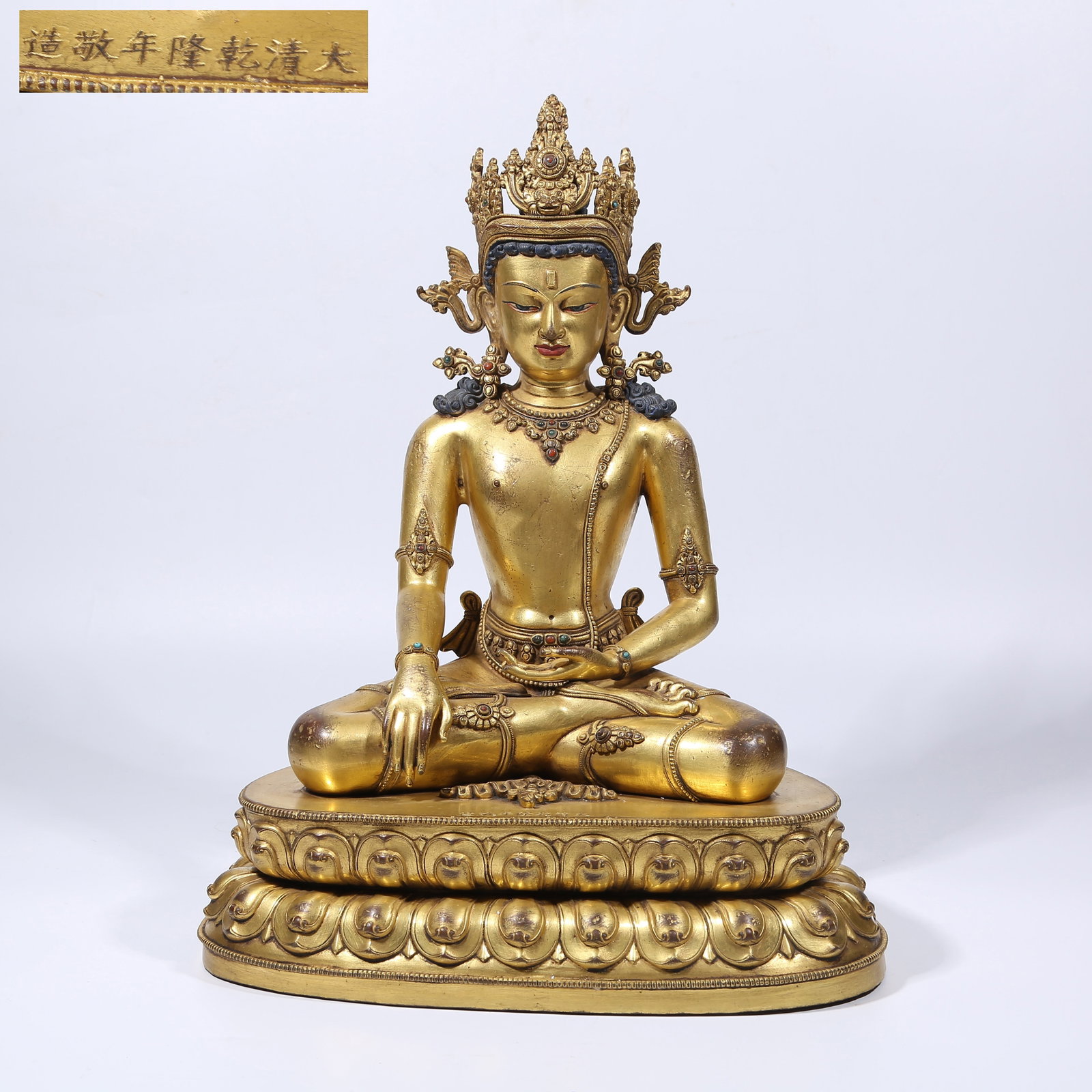 A GILT BRONZE CROWNED SHAKYAMUNI STATUE (1 of 9)