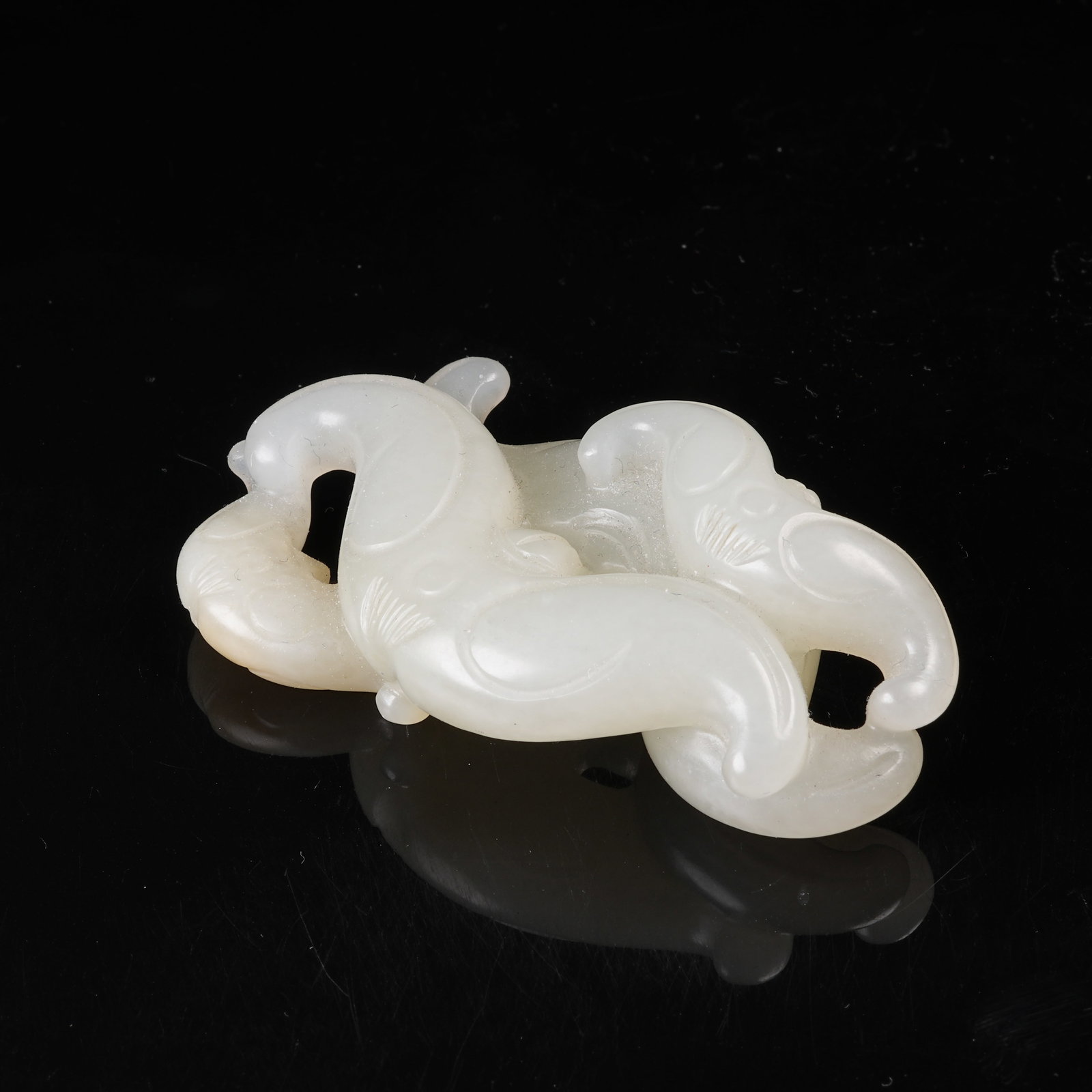 A HETIAN JADE WATER-CHESTNUT-SHAPED PENDANT (1 of 8)