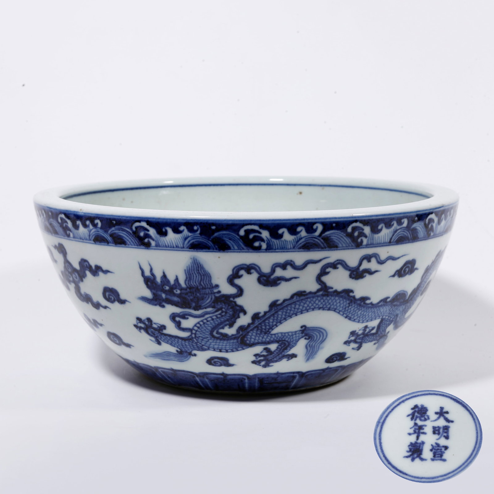 A BLUE AND WHITE VAT WITH CLOUD AND DRAGON PATTERN (1 of 10)