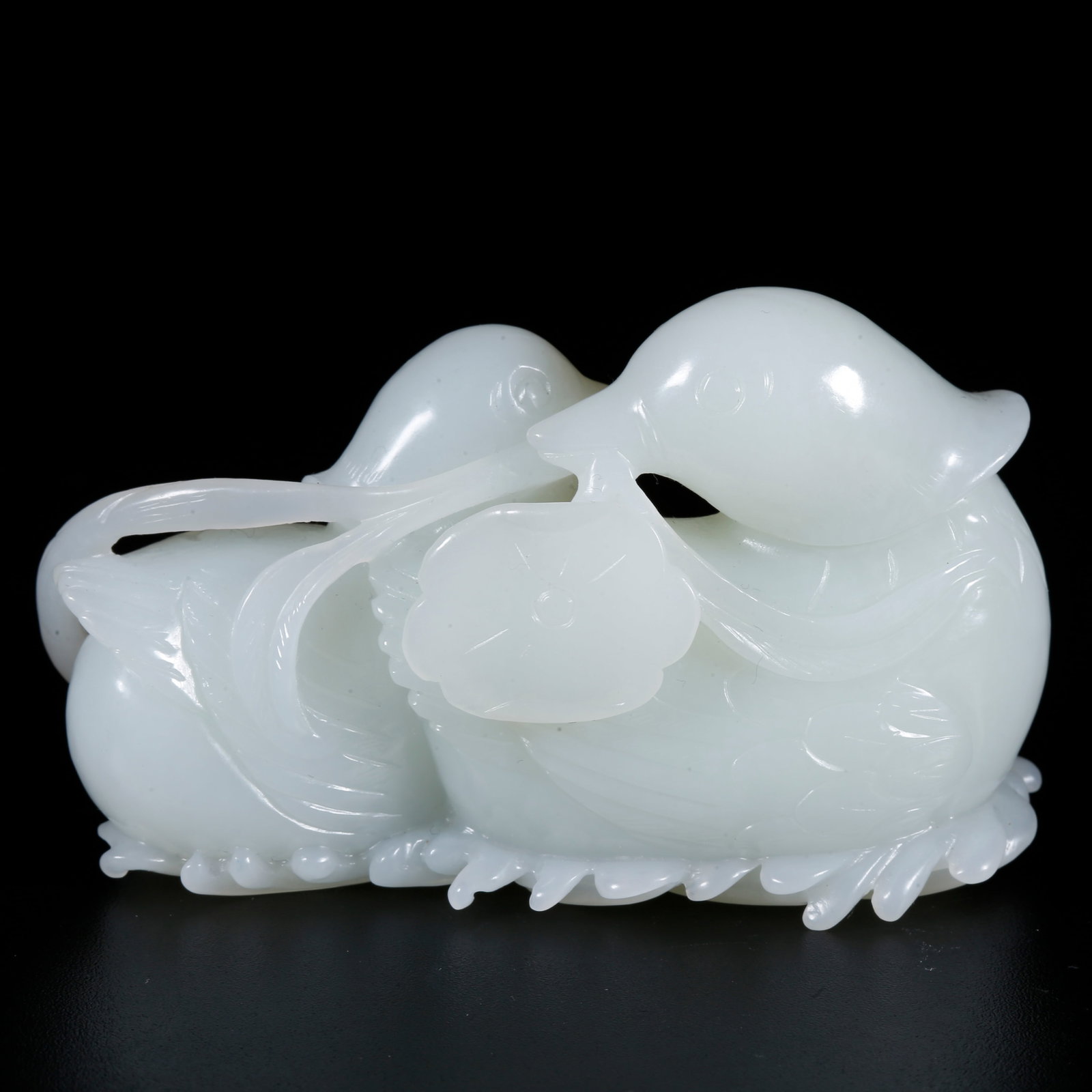 A HOTAN JADE CARVED MANDARIN DUCK-SHAPED ORNAMENT (1 of 9)