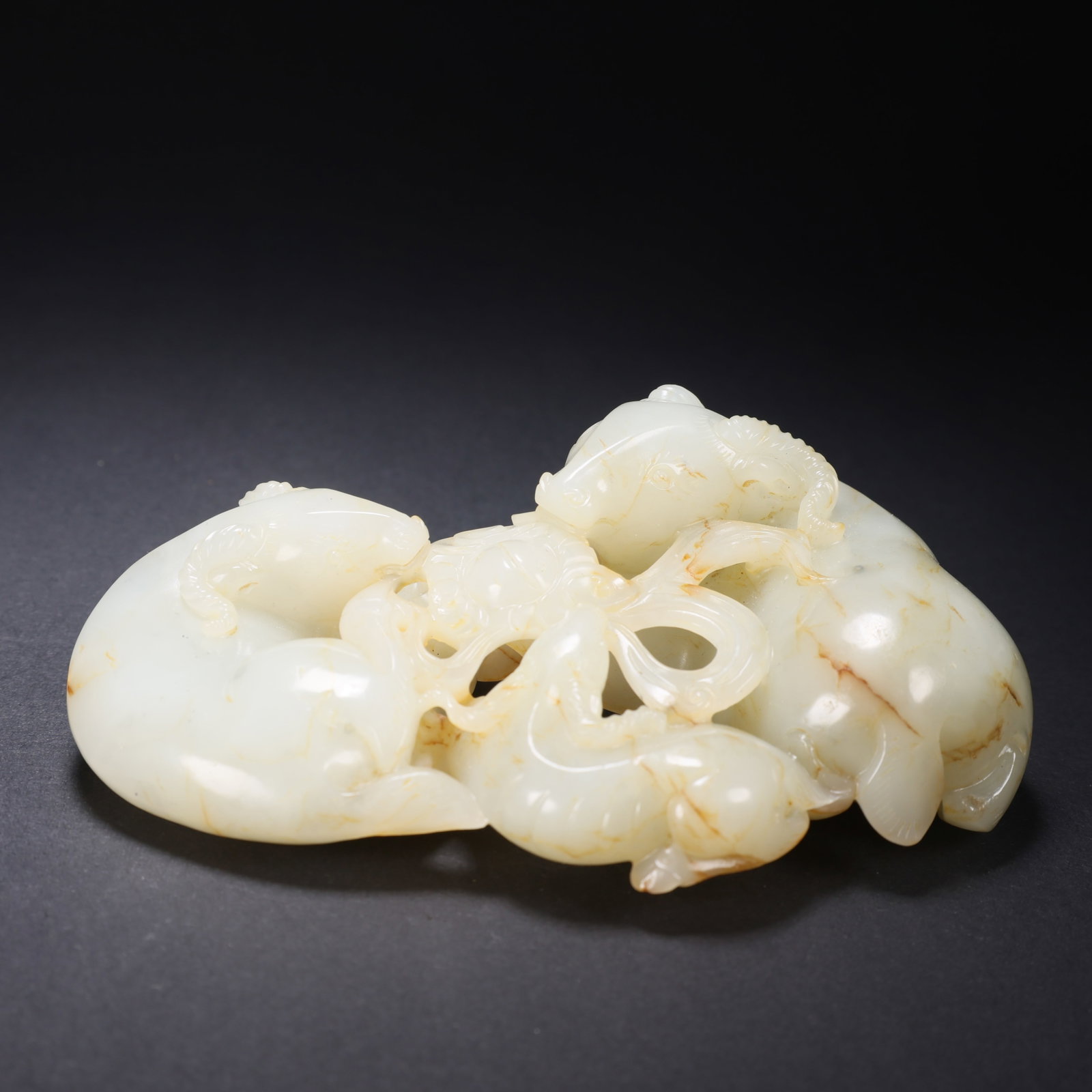 A HETIAN JADE "THREE RAMS BRING GOOD FORTUNE" ORNAMENT (1 of 9)