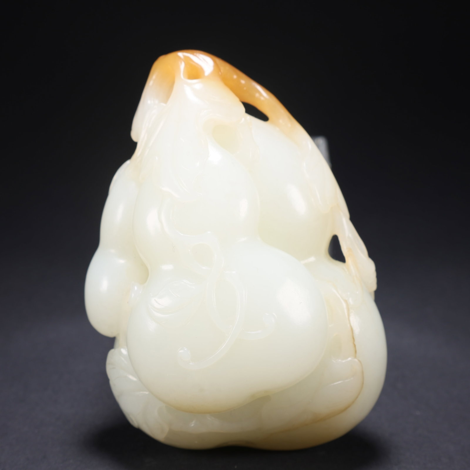 A HETIAN JADE CONTRASTING COLOR GOURD HANDLE ORNAMENT (1 of 9)