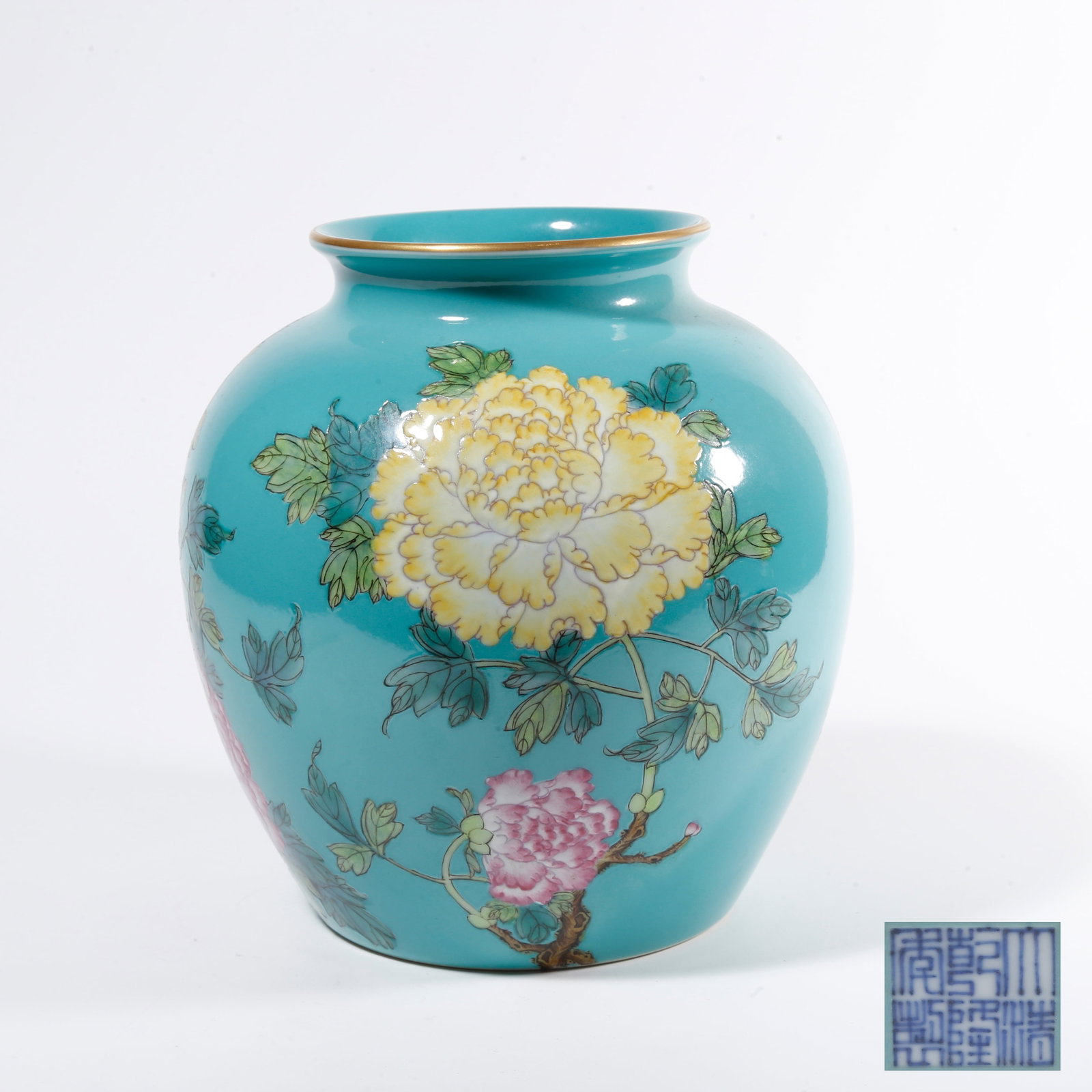 A TURQUOISE GREEN GROUND JAR WITH FLORAL PATTERN: Turquoise Green Ground Jar with Floral Pattern