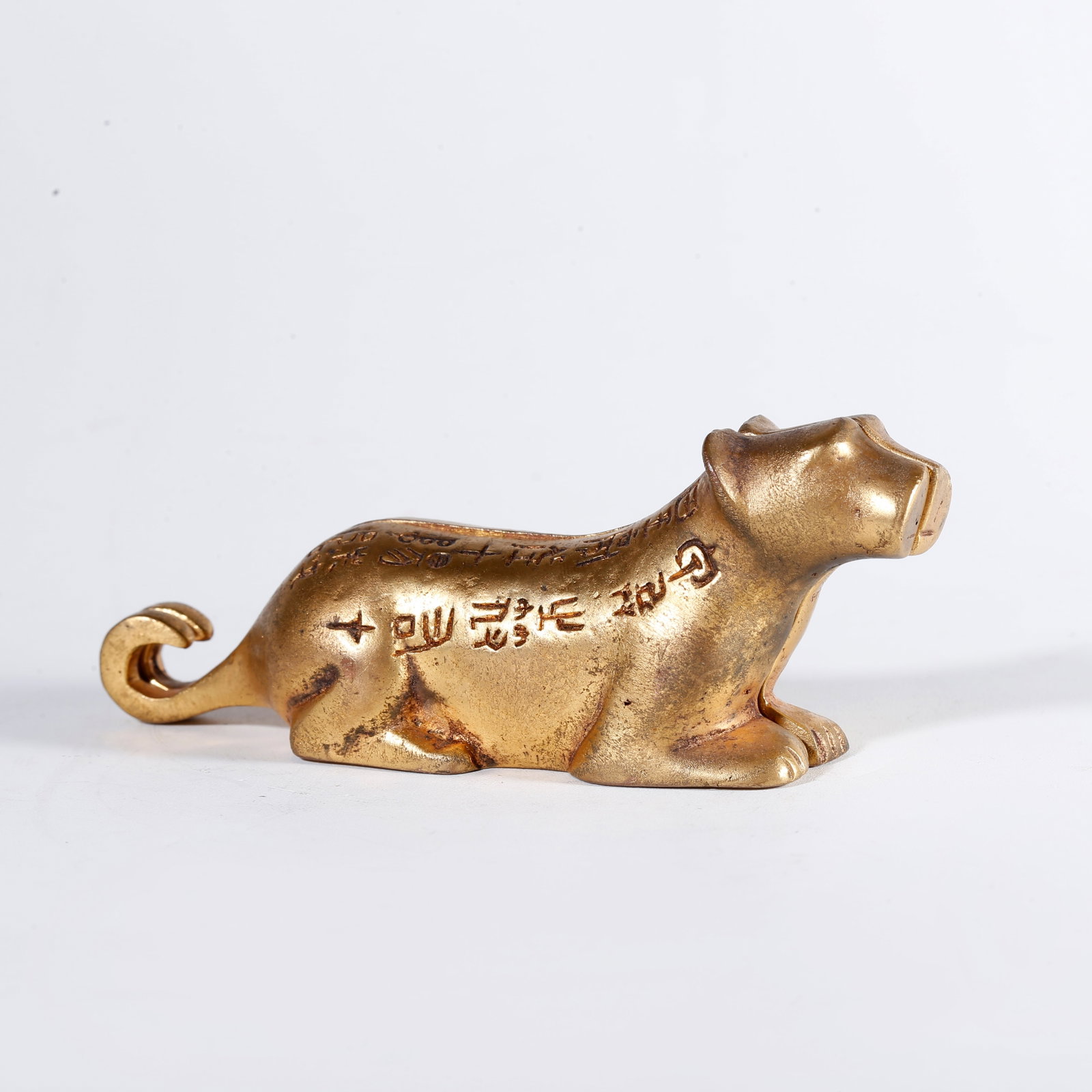 A GILT BRONZE TIGER TALLY (1 of 9)