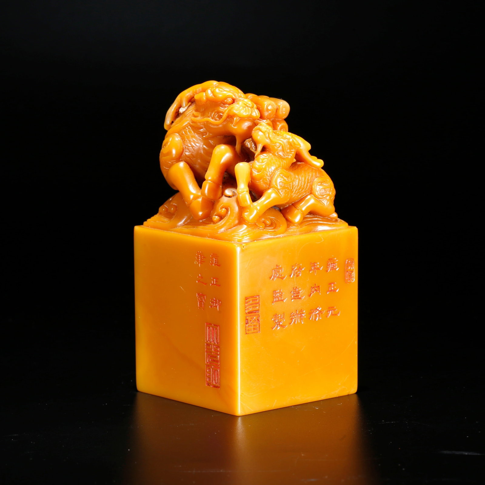 A KYLIN BEARING SCRIPTURE KNOB SEAL CARVED FROM SHOUSHAN TIANHUANG STONE: Kylin Bearing Scripture Knob Seal Carved from Shoushan Tianhuang Stone