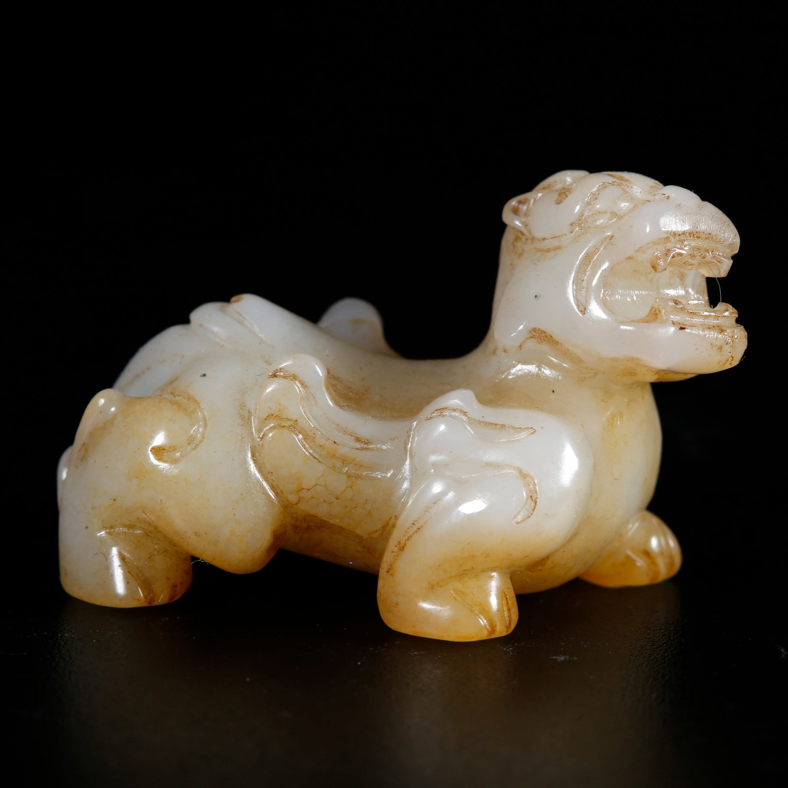 A HOTAN JADE CARVED TIGER-SHAPED ORNAMENT (1 of 10)