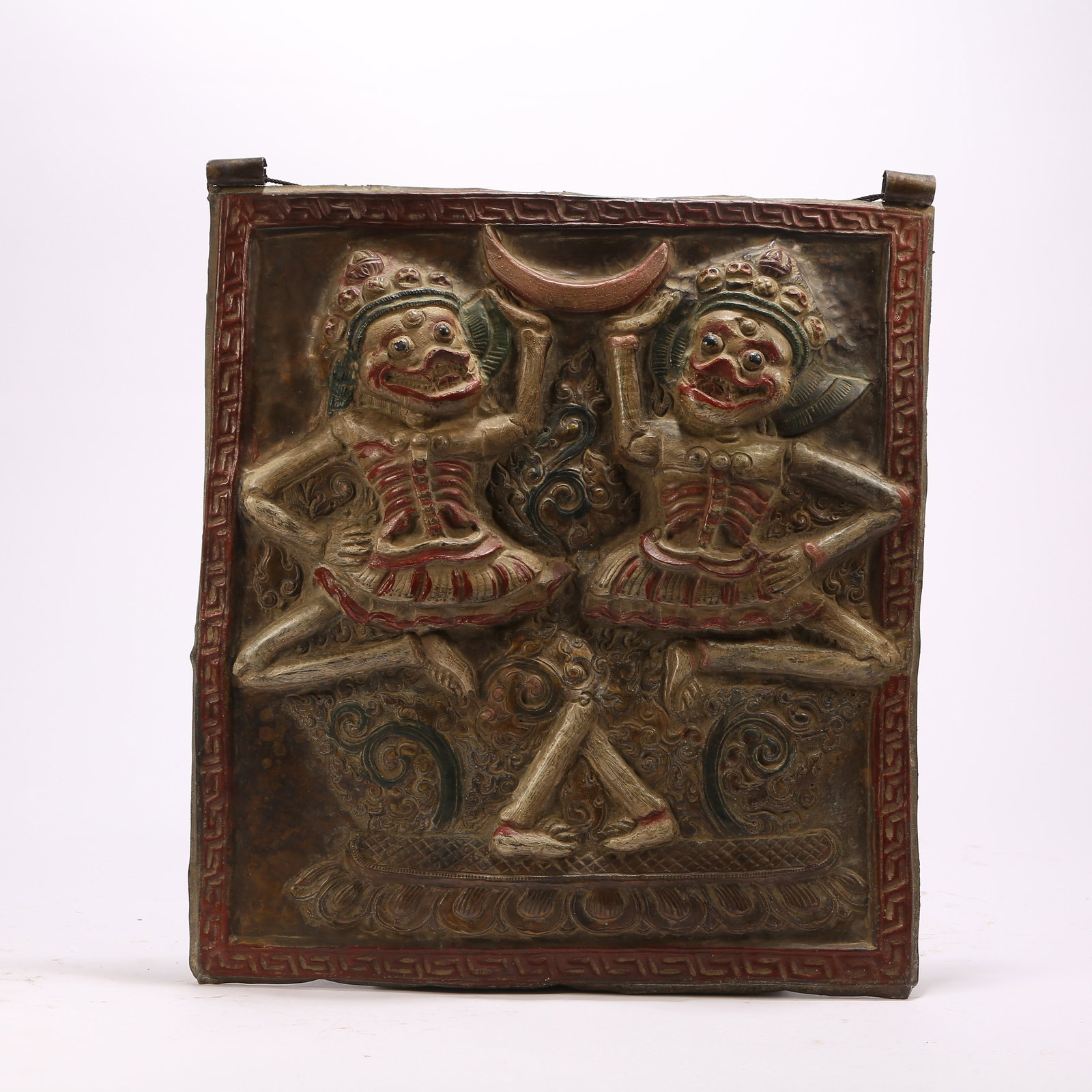 A BRONZE HAMMERED AND POLYCHROME SHITALIN PENDANT: Bronze hammered and polychrome Shitalin pendant