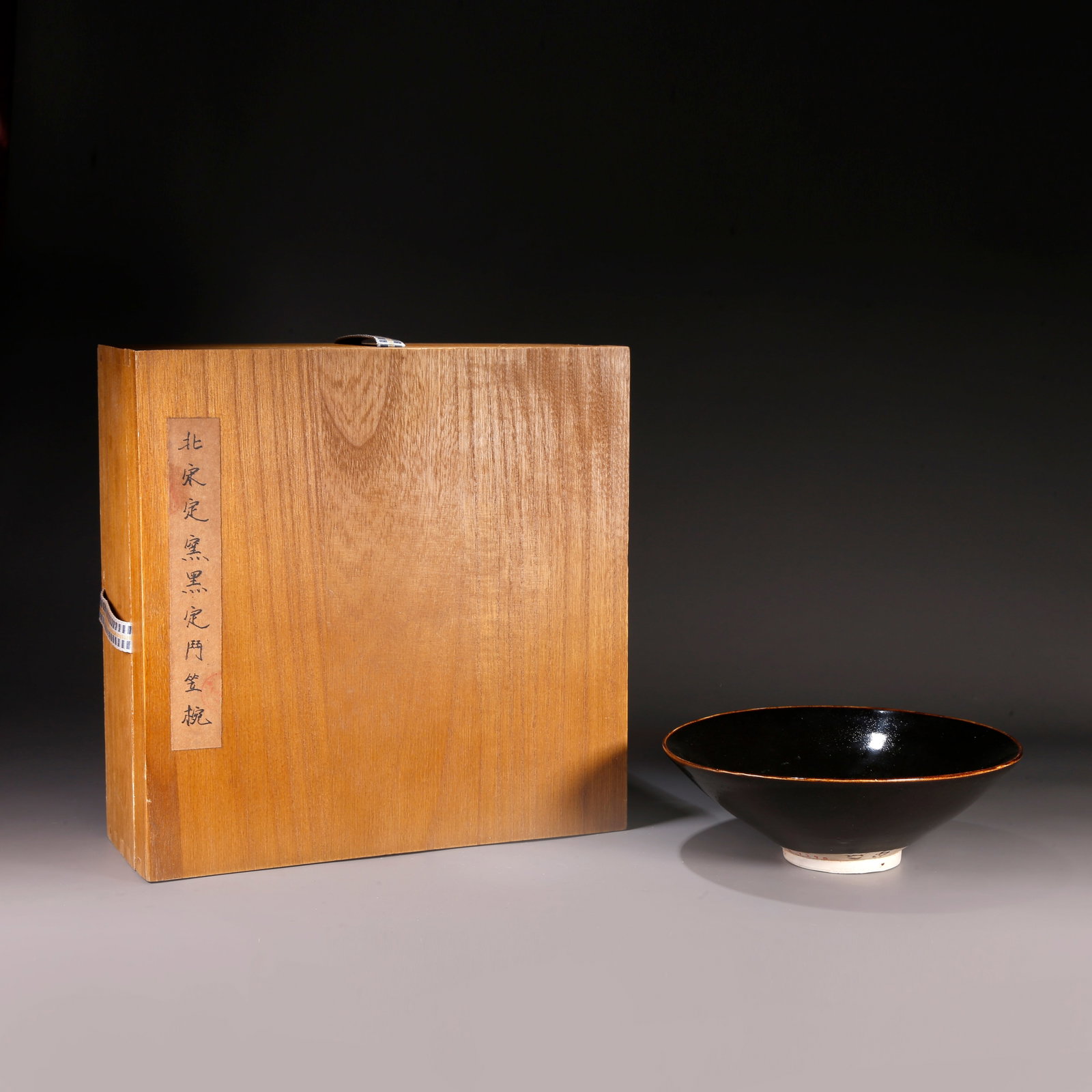 A BLACK GLAZED HAT-SHAPED BOWL: Black Glazed Hat-shaped Bowl