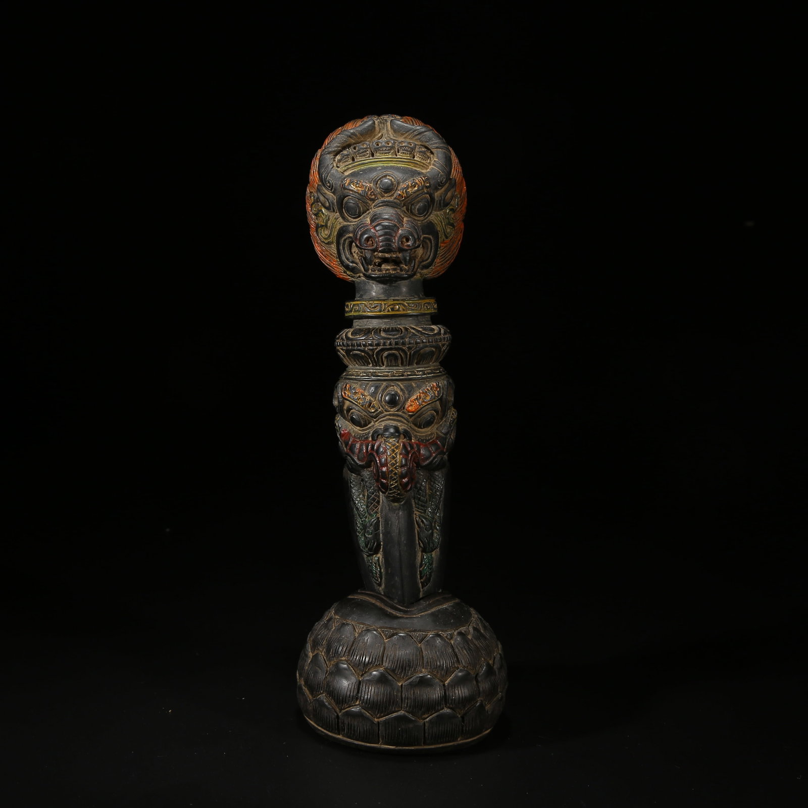 A BLACK STONE WITH POLYCHROME MAH?V?RA VAJRA PICK RITUAL OBJECT: Black Stone with Polychrome Mahavira Vajra Pick Ritual Object
