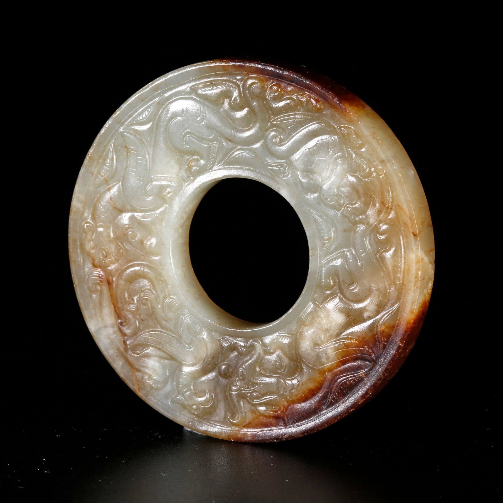 A HETIAN JADE CARVED BI DISC WITH ANIMAL MOTIFS (1 of 10)