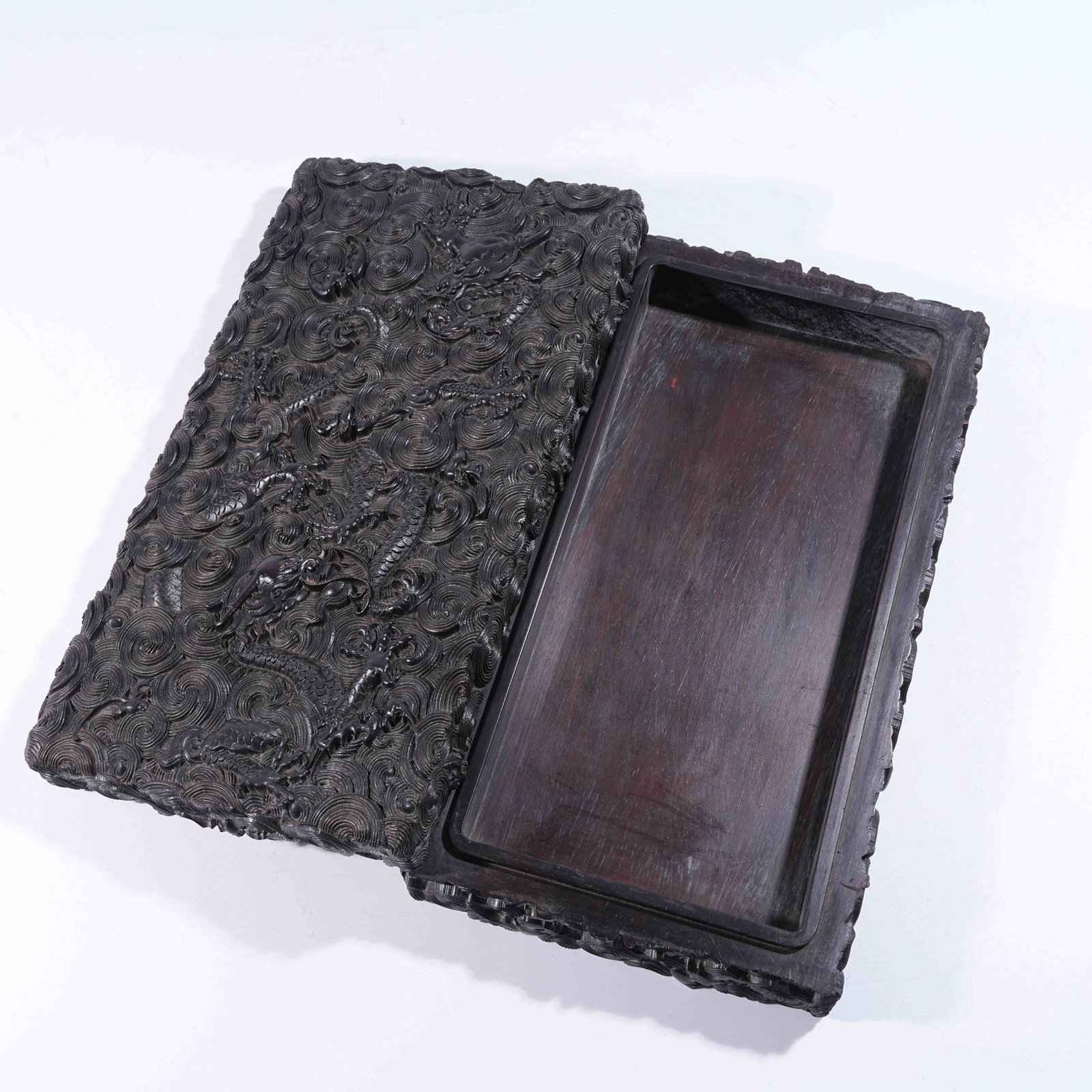 A ZITAN COVERED BOX WITH CLOUD-AND-DRAGON MOTIF: Zitan Covered Box with Cloud-and-Dragon Motif