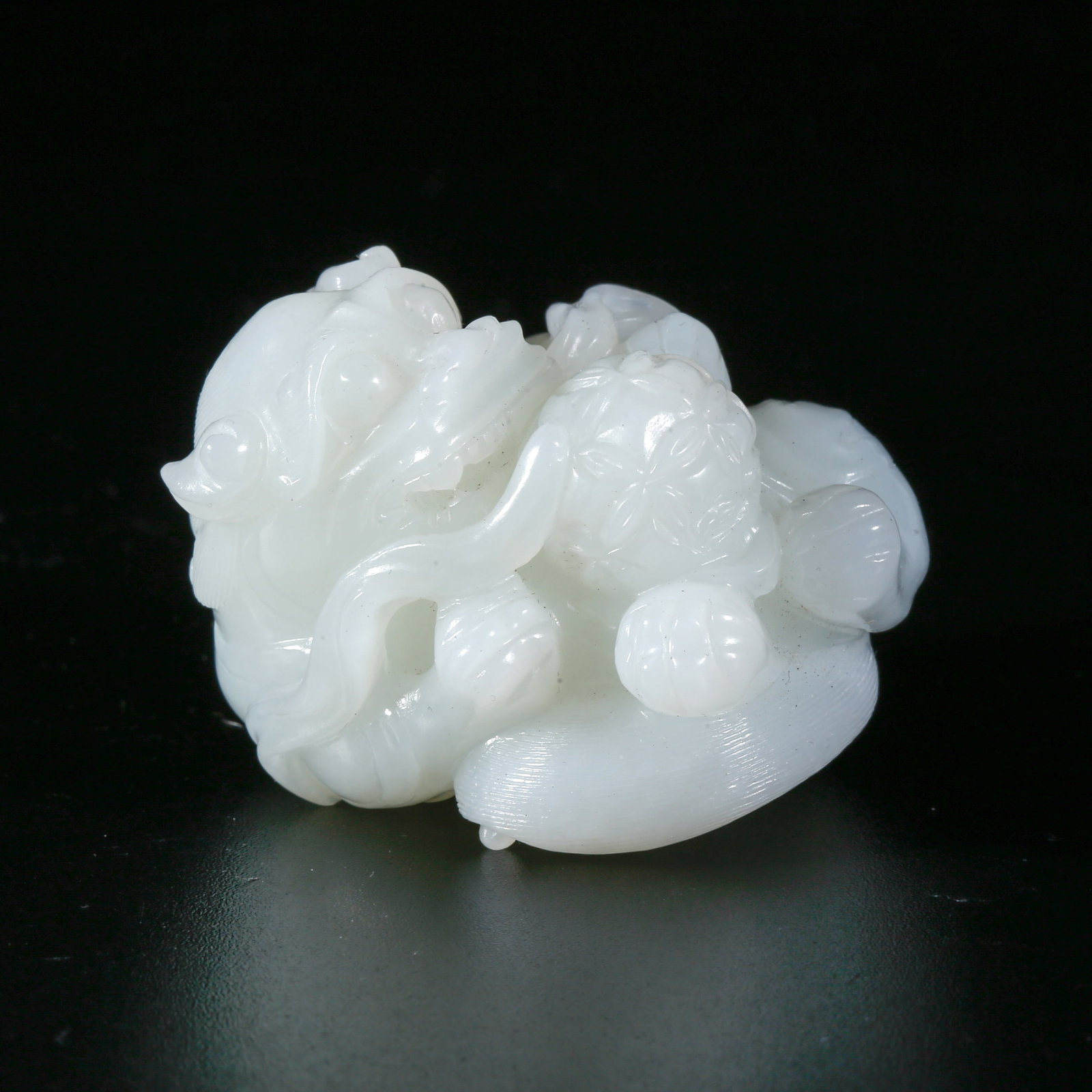 A HETIAN JADE CARVING OF LION PLAYING WITH BALL FIGURINE (1 of 9)