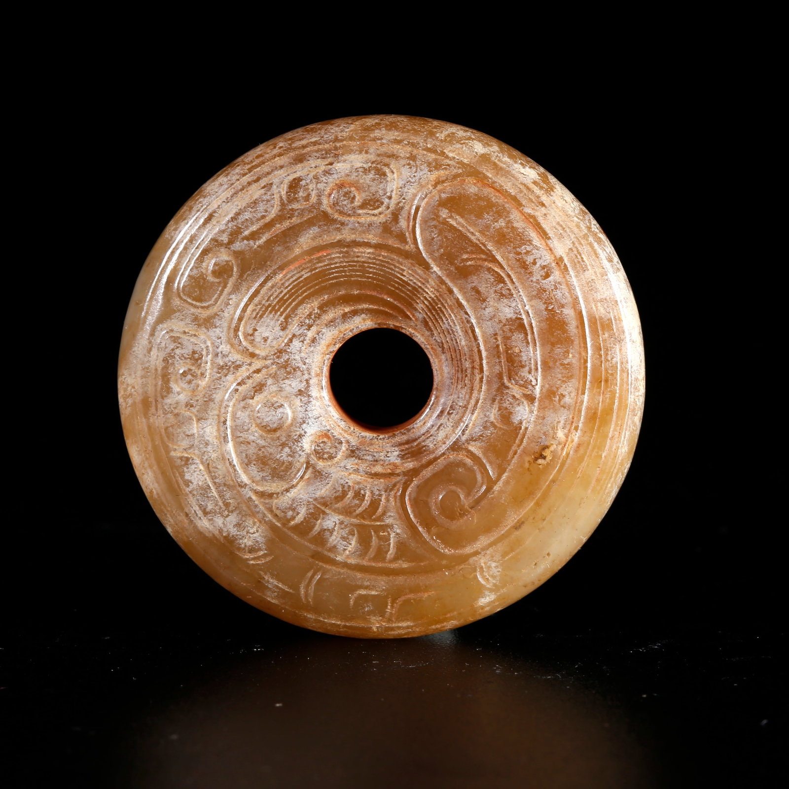 A HETIAN JADE CARVED SMALL BI DISC WITH SUSPENSION LOOP (1 of 8)