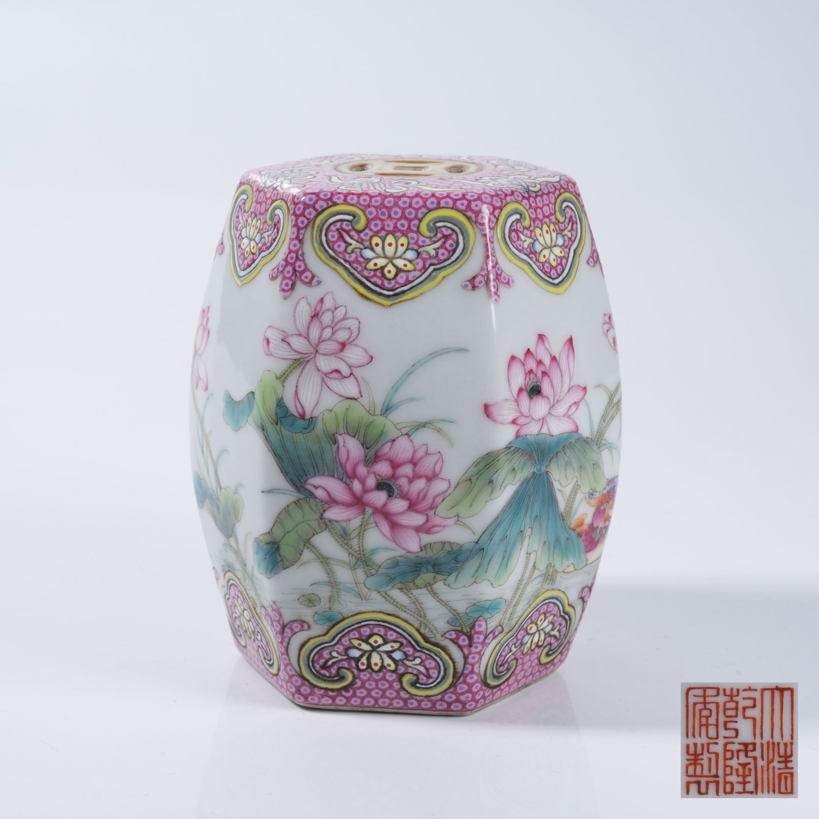 A FAMILLE ROSE DRUM STOOL WITH LOTUS POND LEISURE PATTERN: Famille Rose Drum Stool with Lotus Pond Leisure Pattern