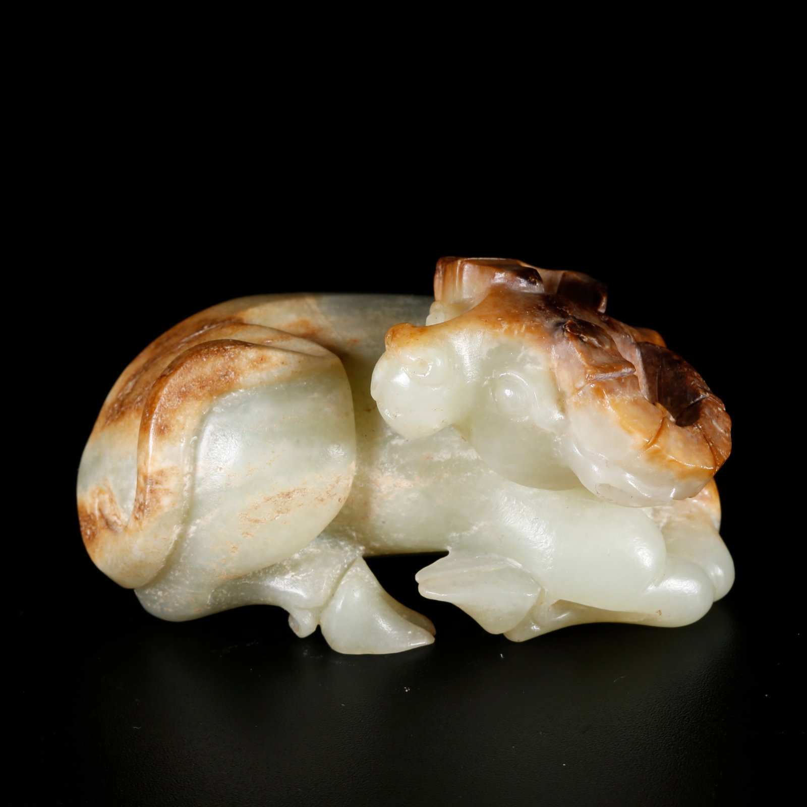 A HETIAN JADE CARVING OF AN OX-SHAPED ORNAMENT (1 of 9)