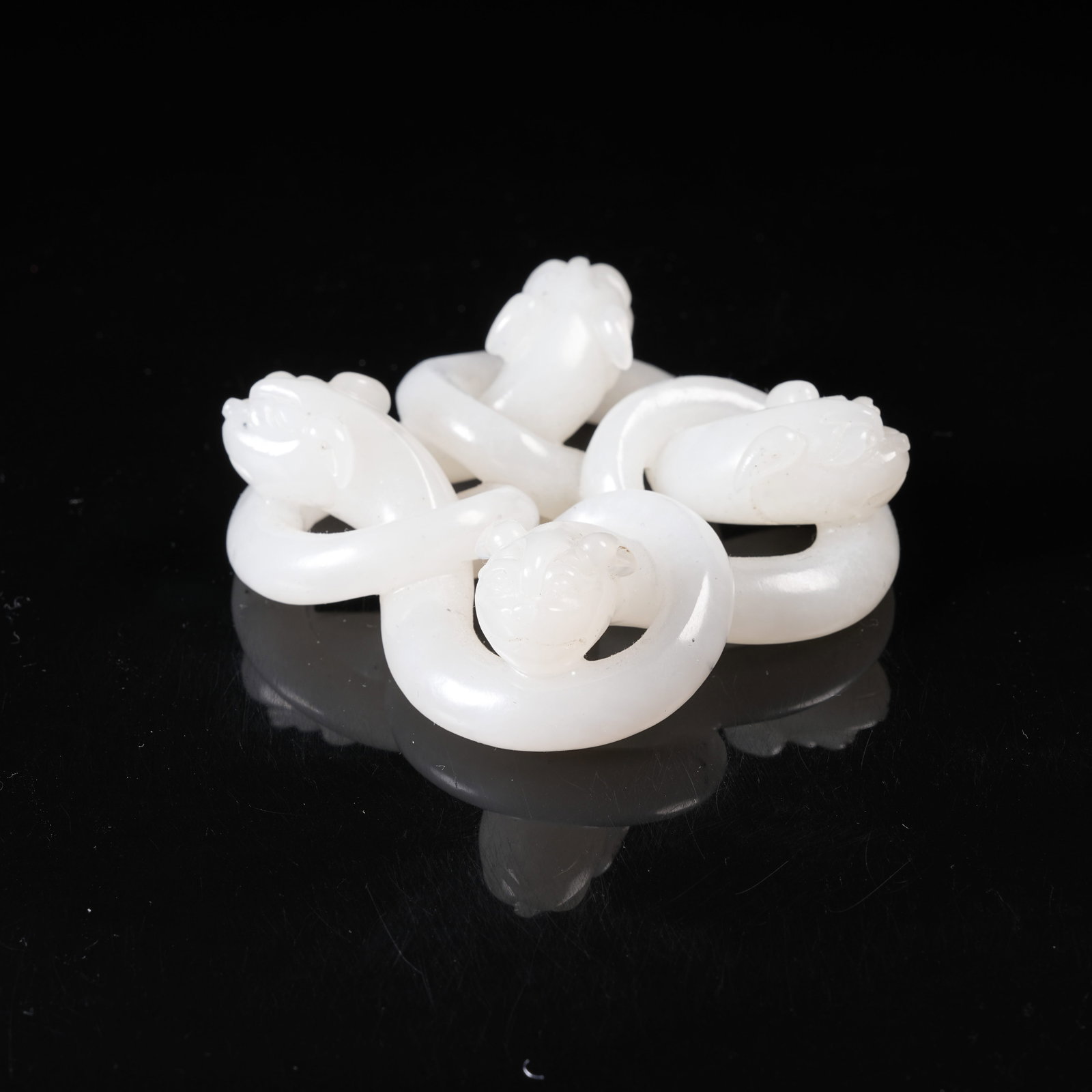 A HETIAN WHITE JADE PENDANT WITH DRAGON CLASP: Hetian White Jade Pendant with Dragon Clasp