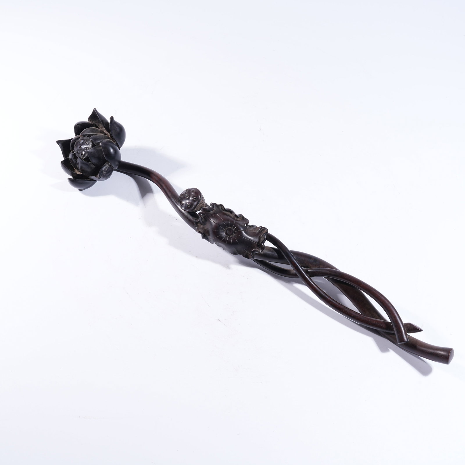 A RUYI SCEPTER IN ZITAN WOOD, CARVED IN LOTUS FORM (1 of 6)