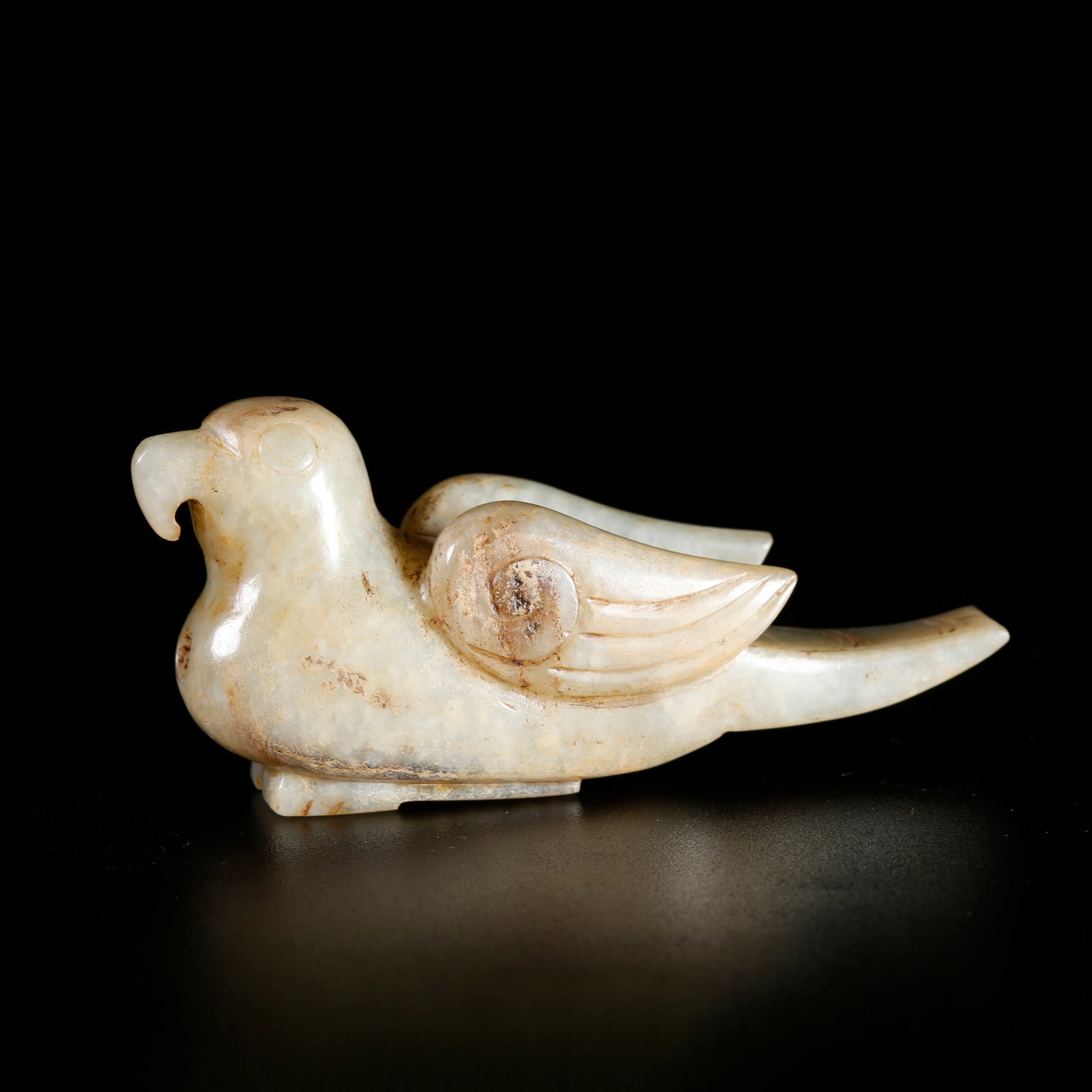 A HETIAN JADE CARVED PHOENIX-SHAPED ORNAMENT (1 of 10)