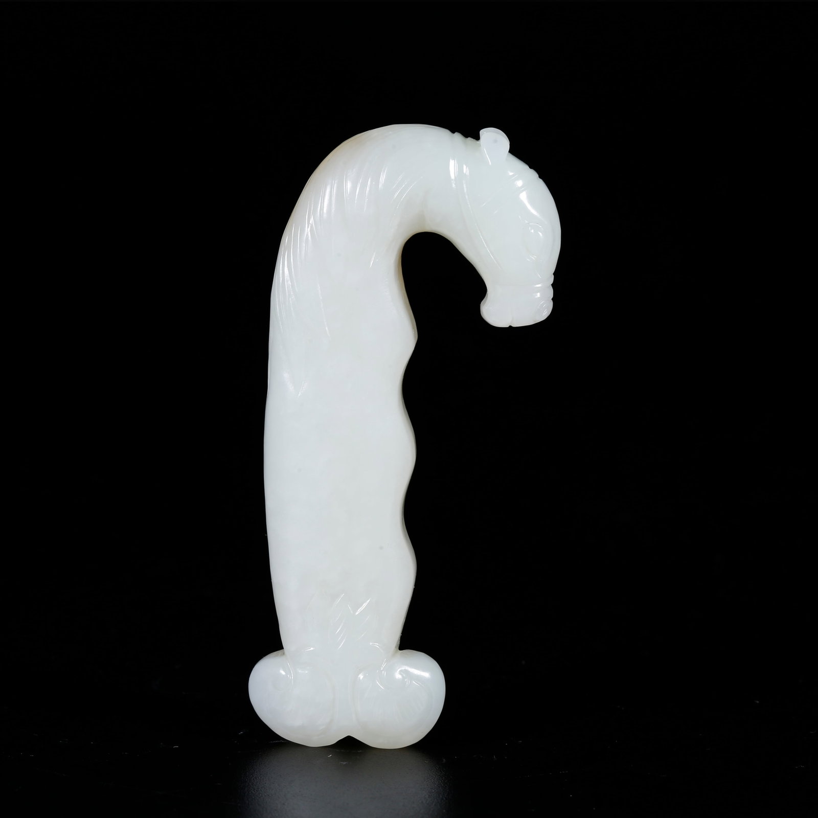 A HOTAN JADE CARVED SWORD HILT: Hotan Jade Carved Sword Hilt