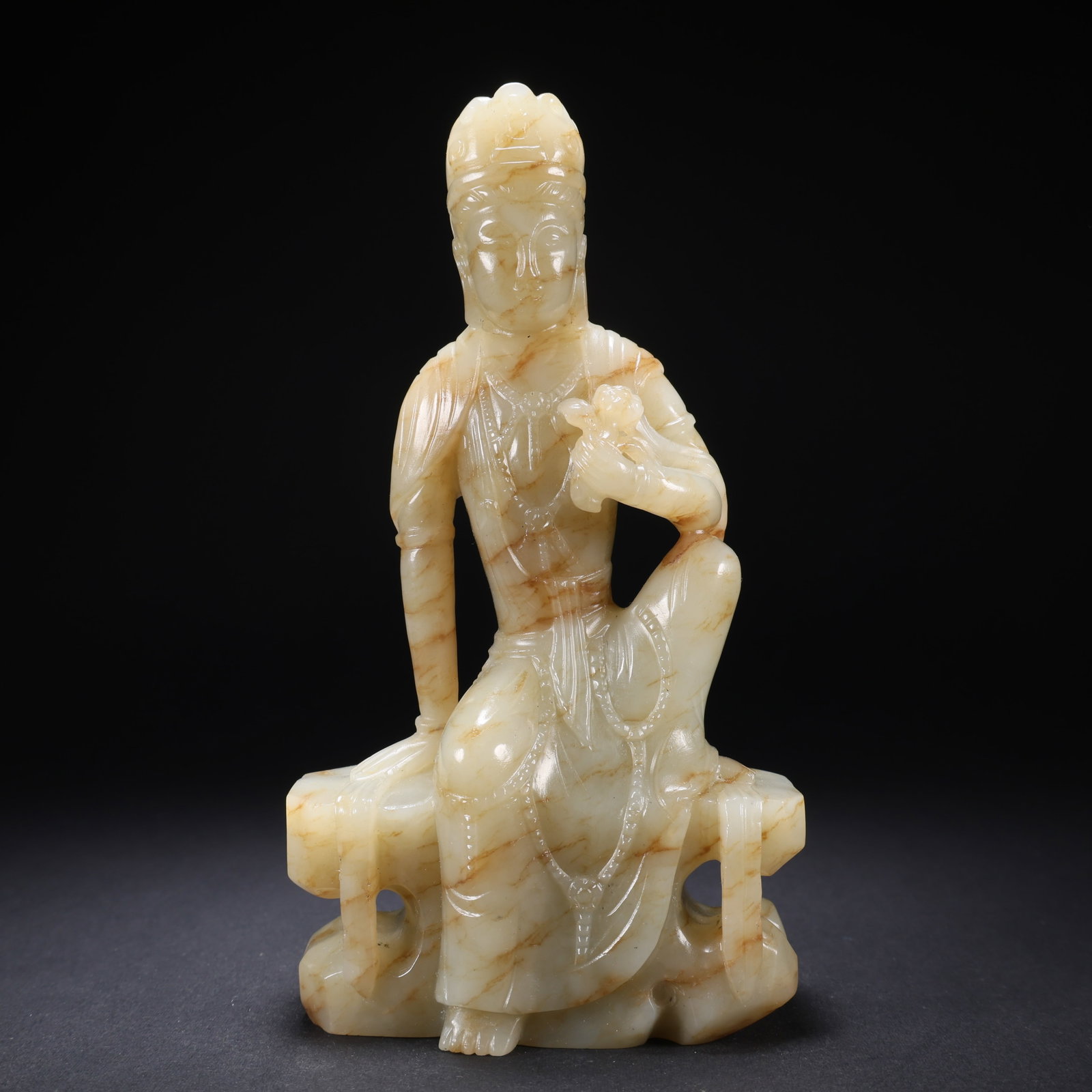 A HETIAN JADE SEATED BUDDHA: Hetian Jade Seated Buddha