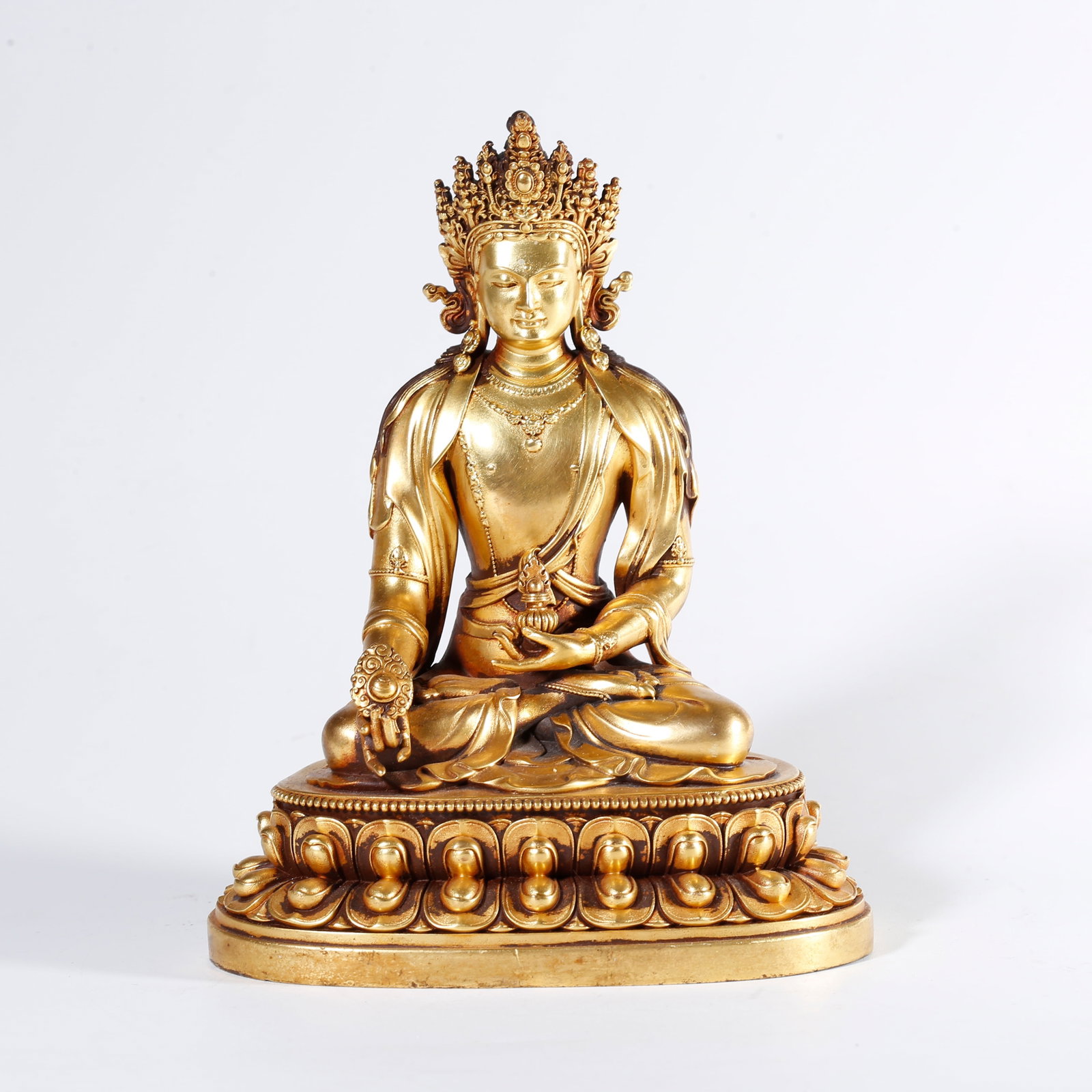 A GILT BRONZE STATUE OF MEDICINE BUDDHA: Gilt Bronze Statue of Medicine Buddha