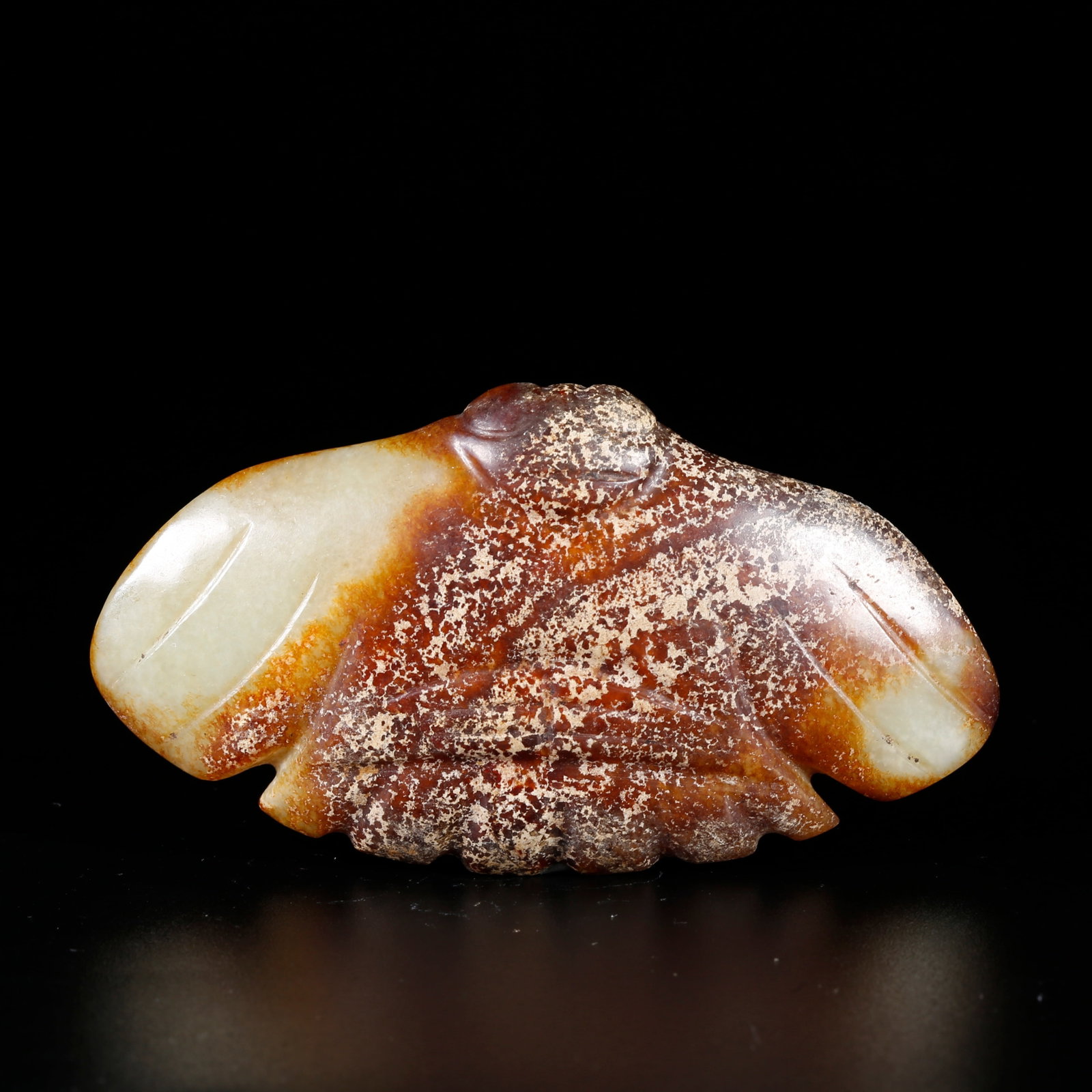 A ARCHAIC JADE CARVING OF A BIRD-SHAPED PENDANT (1 of 10)