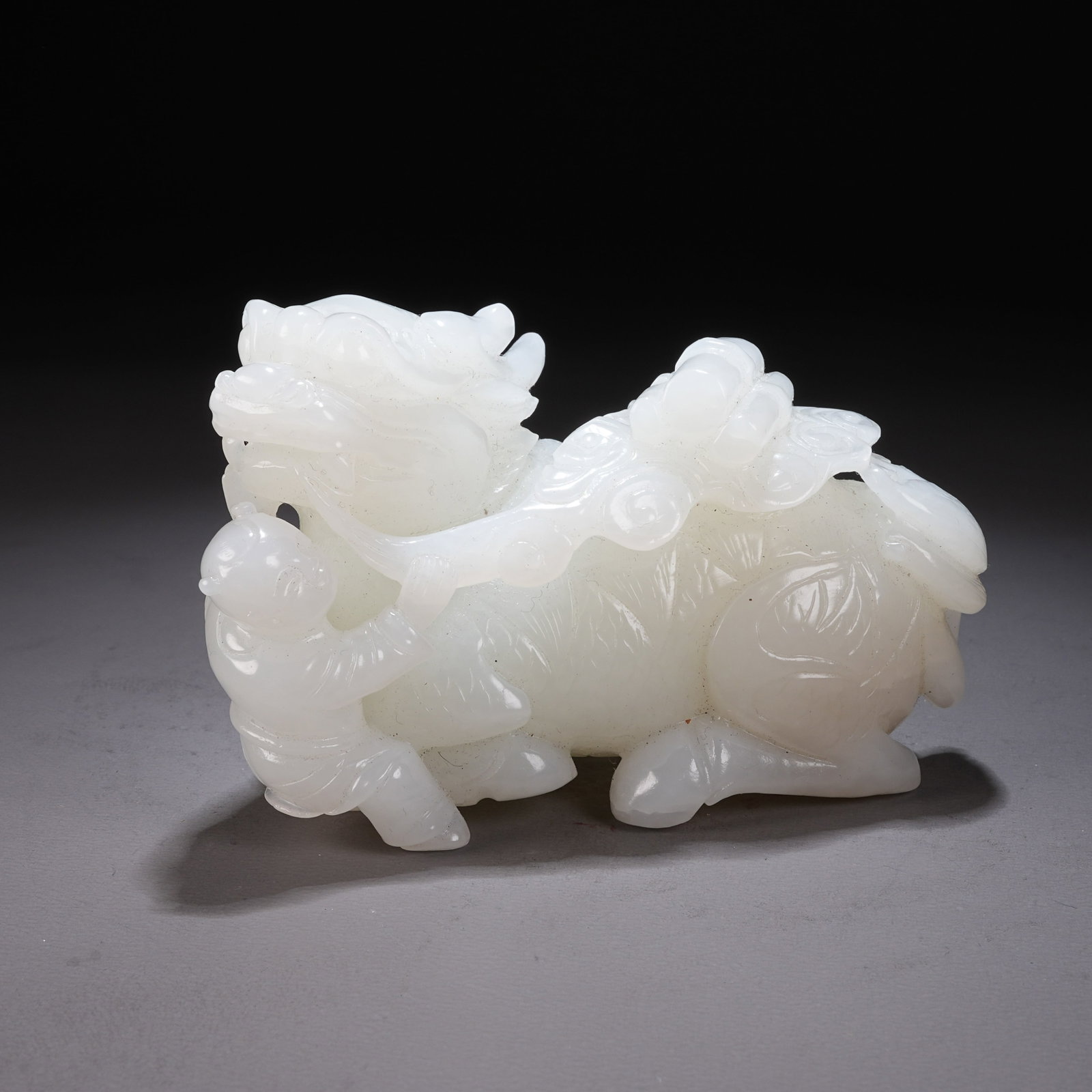 A HETIAN WHITE JADE "QILIN BEARING A BOOK" ORNAMENT (1 of 8)