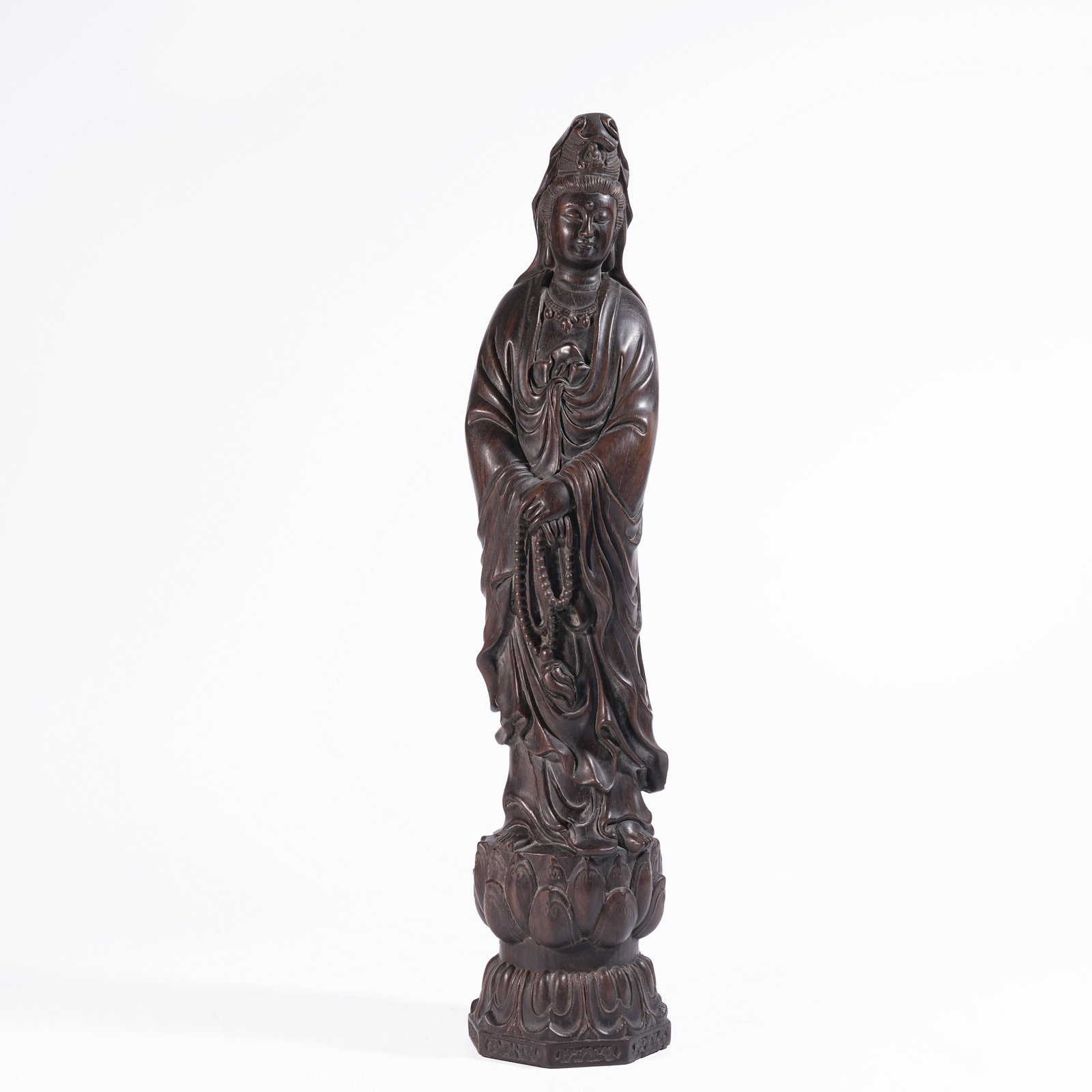 A STANDING FIGURE OF GUANYIN IN ZITAN WOOD (1 of 9)