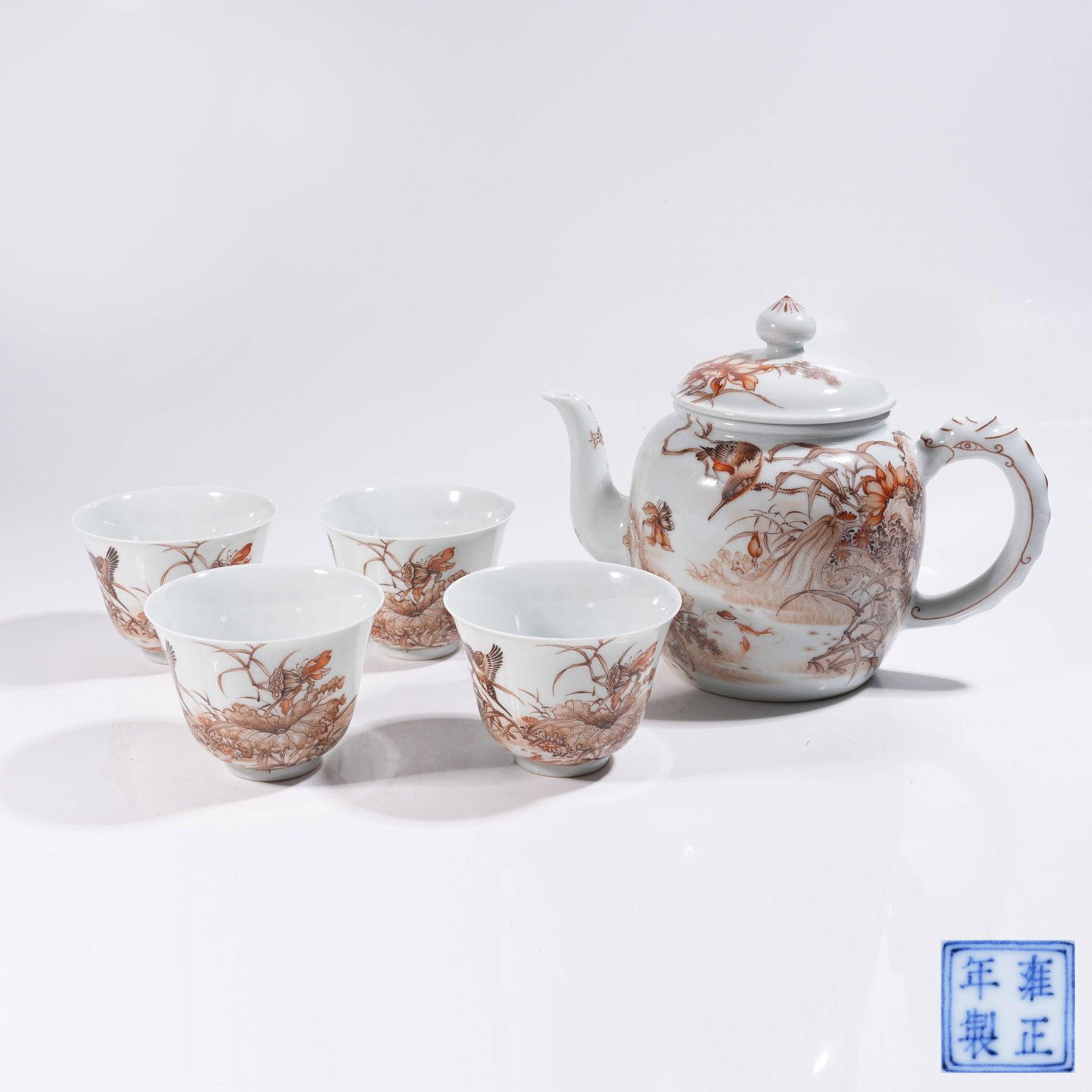 A SET OF IRON-RED EWER AND TEACUPS WITH FLOWER, BIRD, FISH AND INSECT PATTERN: Set of Iron-red Ewer and Teacups with Flower, Bird, Fish and Insect Pattern