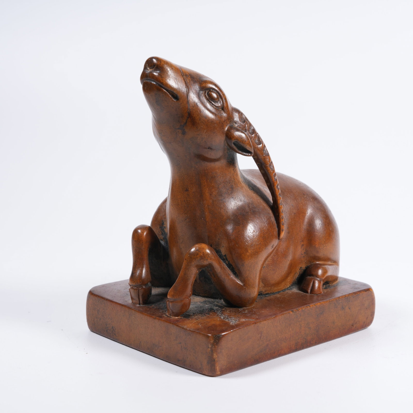A SANDALWOOD SEAL WITH RECUMBENT SHEEP KNOB: Sandalwood Seal with Recumbent Sheep Knob