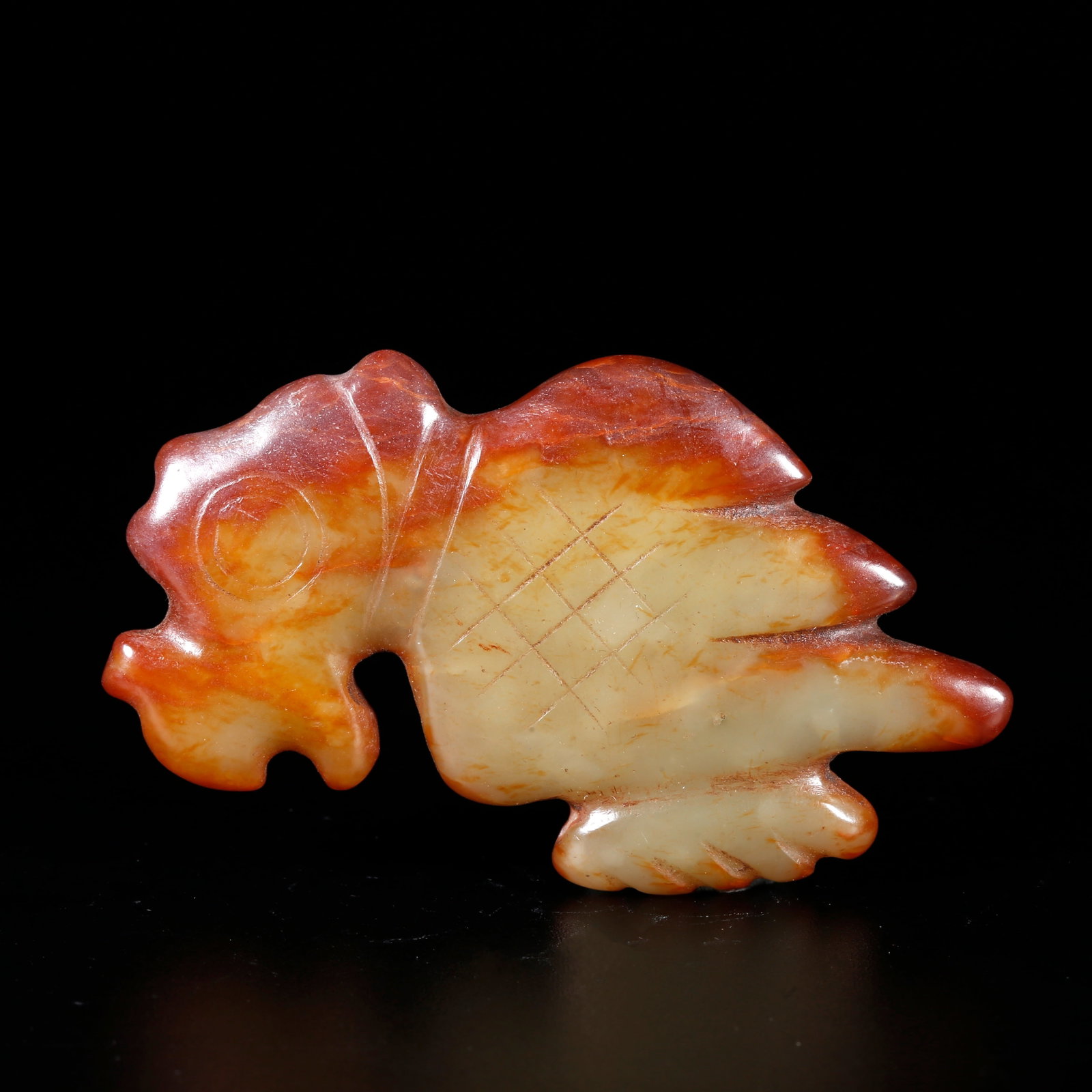 A HETIAN JADE CARVING OF AN ANIMAL-SHAPED PENDANT (1 of 10)