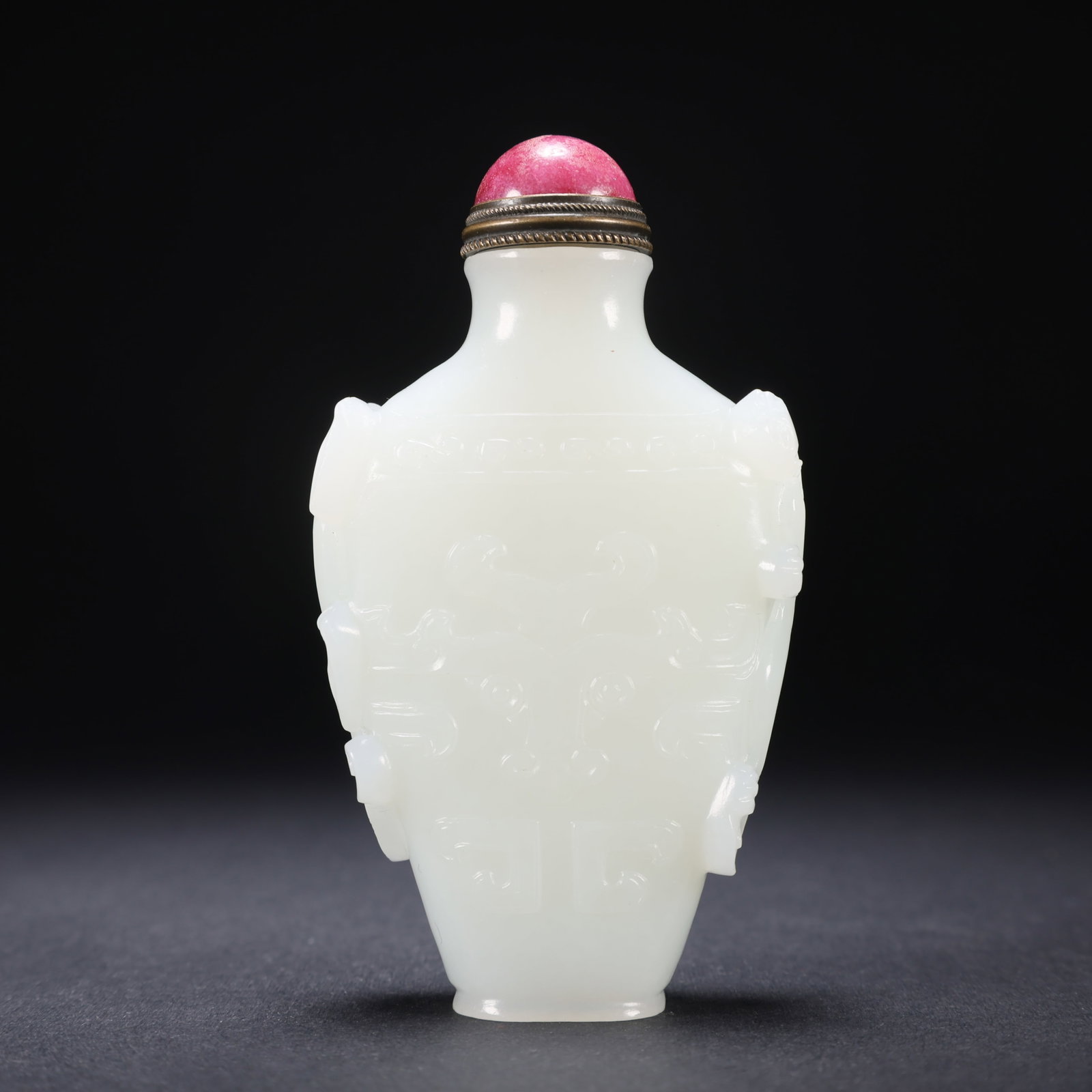 A HETIAN JADE DOUBLE-DRAGON BEAST-FACE SNUFF BOTTLE (1 of 9)