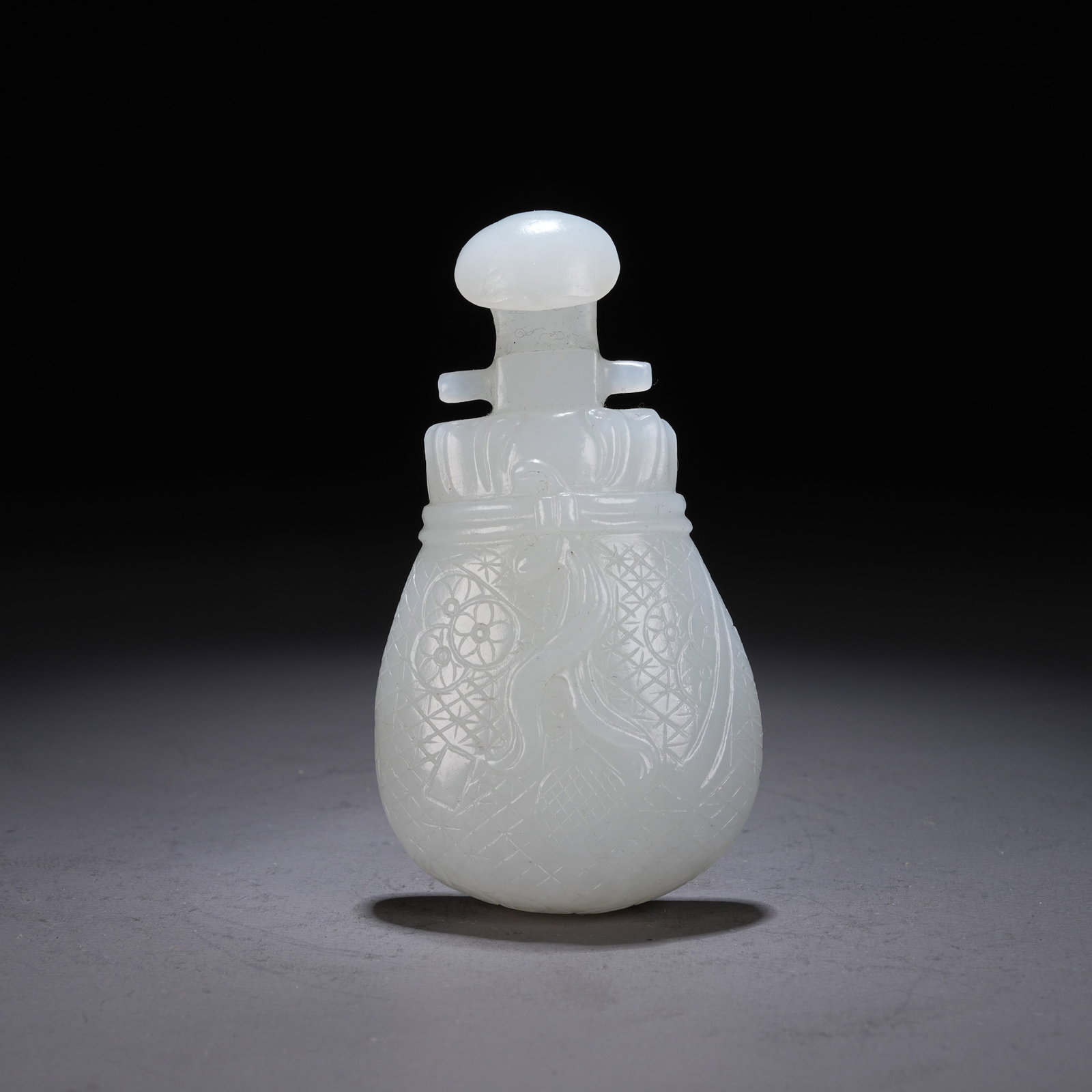 A HETIAN WHITE JADE ORNAMENT WITH WRAPPED CLOTH MOTIF (1 of 8)