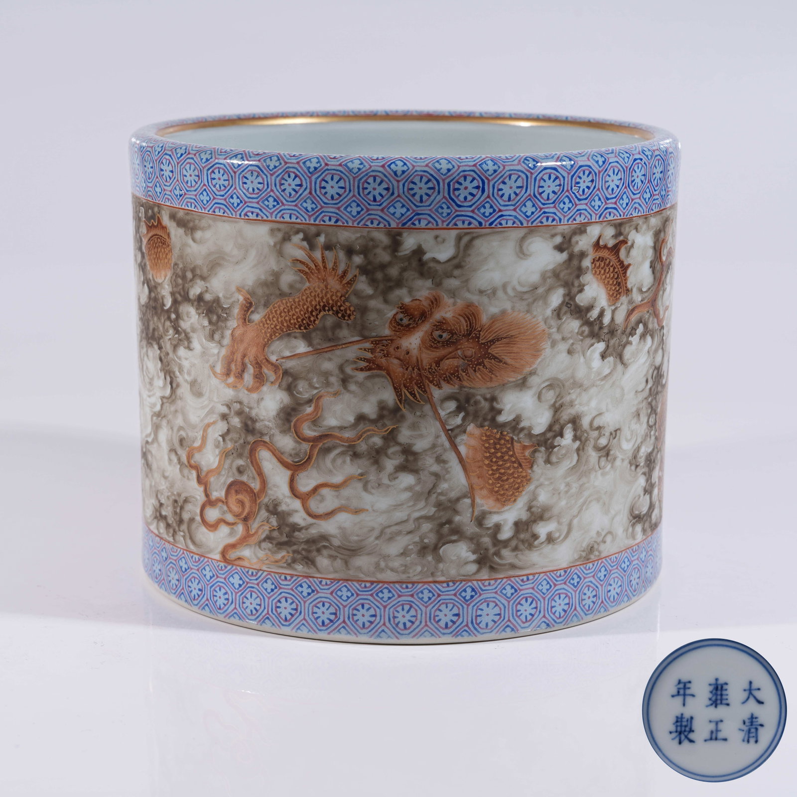 A STONE-GRAIN GLAZED IRON-RED GILDED BRUSH POT WITH CLOUD AND DRAGON PATTERN (1 of 9)
