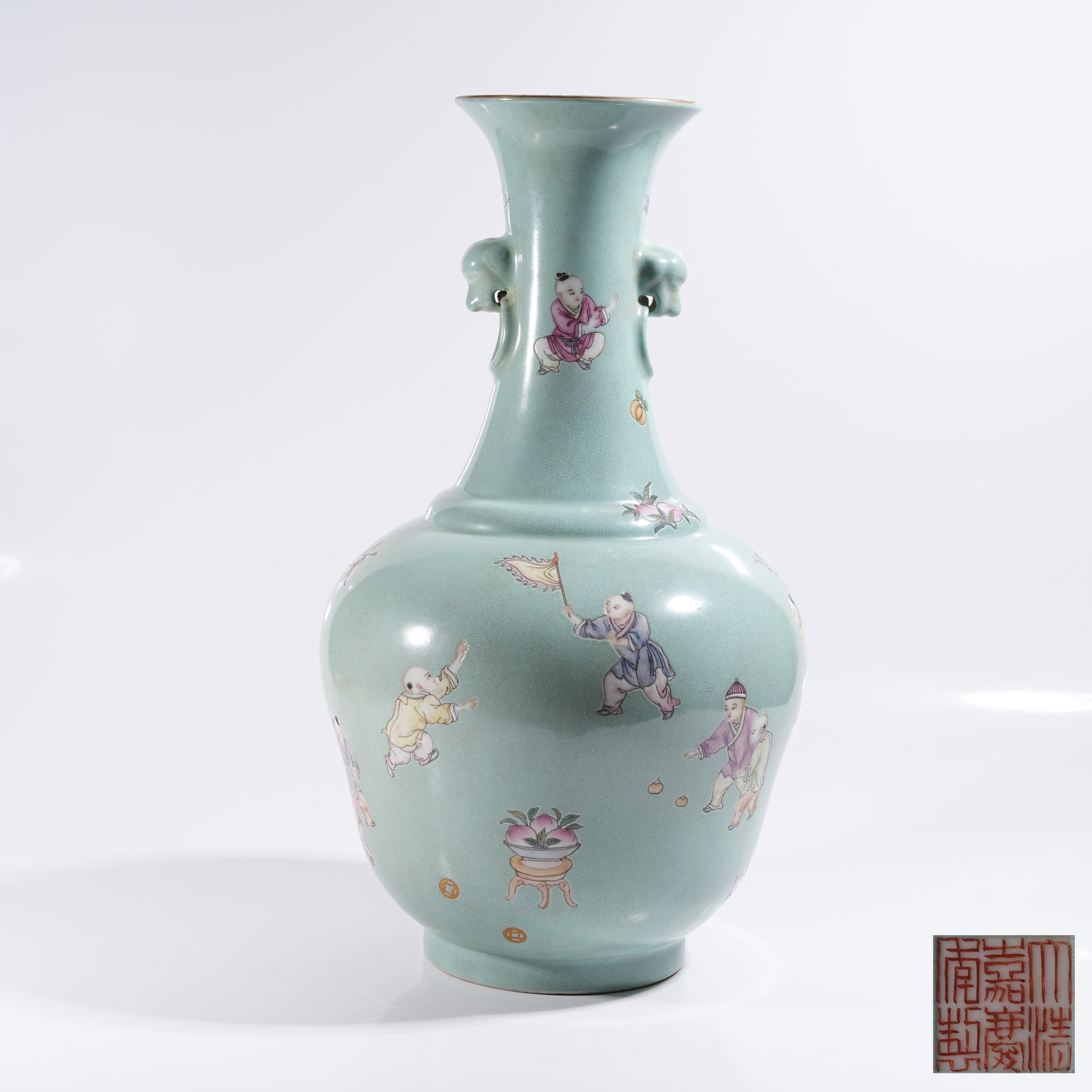 A TURQUOISE GREEN GROUND FAMILLE ROSE PLATE-MOUTHED VASE WITH BEAST HEADS AND CHILDREN AT PLAY: Turquoise Green Ground Famille Rose Plate-mouthed Vase with Beast Heads and Children at Play Pattern