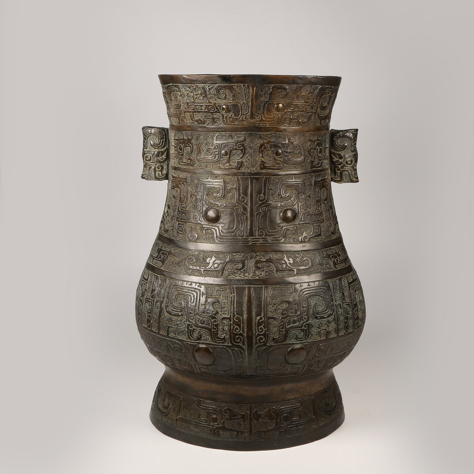 A BRONZE EWER WITH KUI-DRAGON MOTIFS AND ANIMAL-FORM HANDLES: Bronze Ewer with Kui-Dragon Motifs and Animal-Form Handles